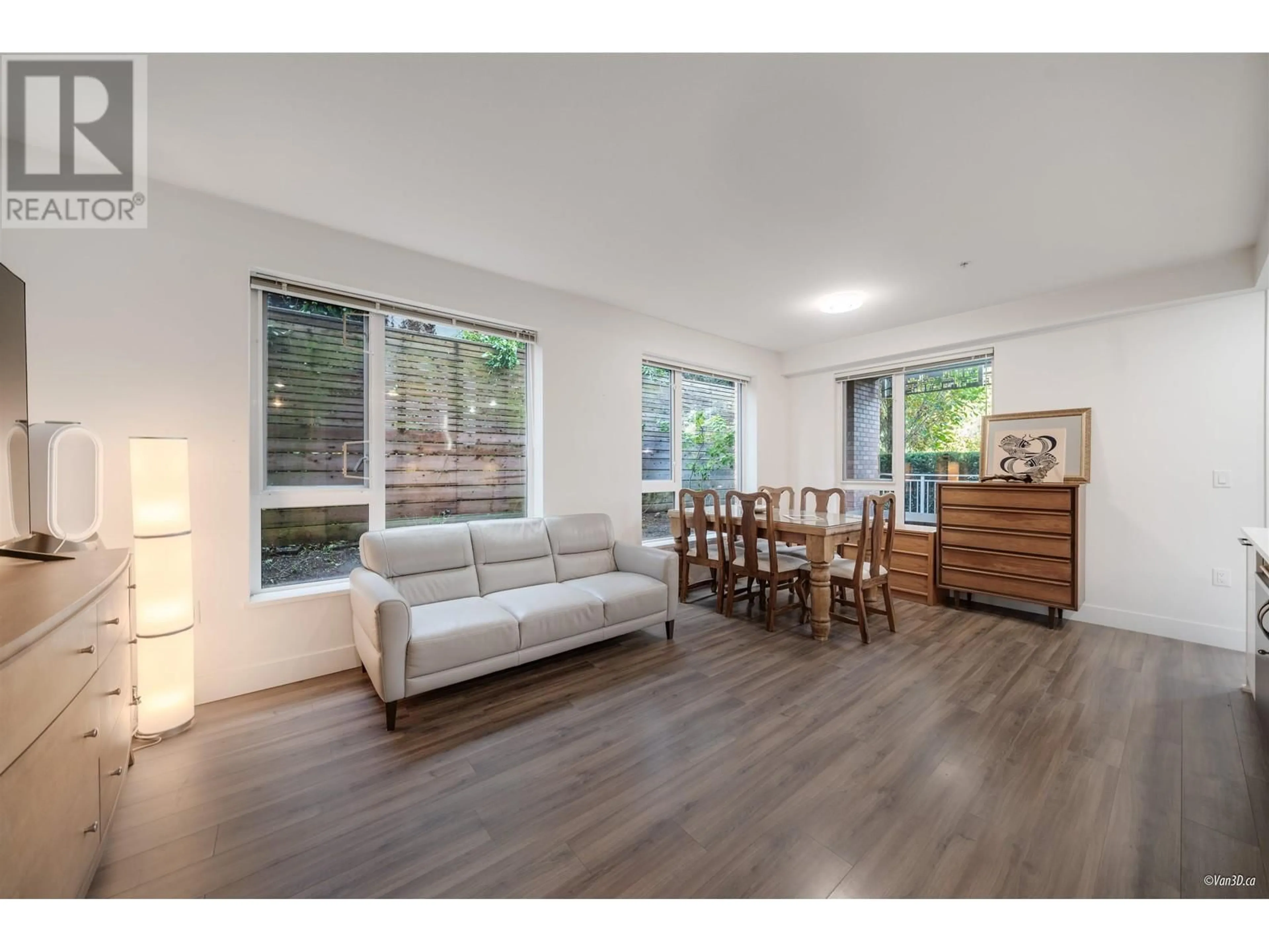 Living room with furniture, wood/laminate floor for 106 - 6933 CAMBIE STREET, Vancouver British Columbia V6P0J1
