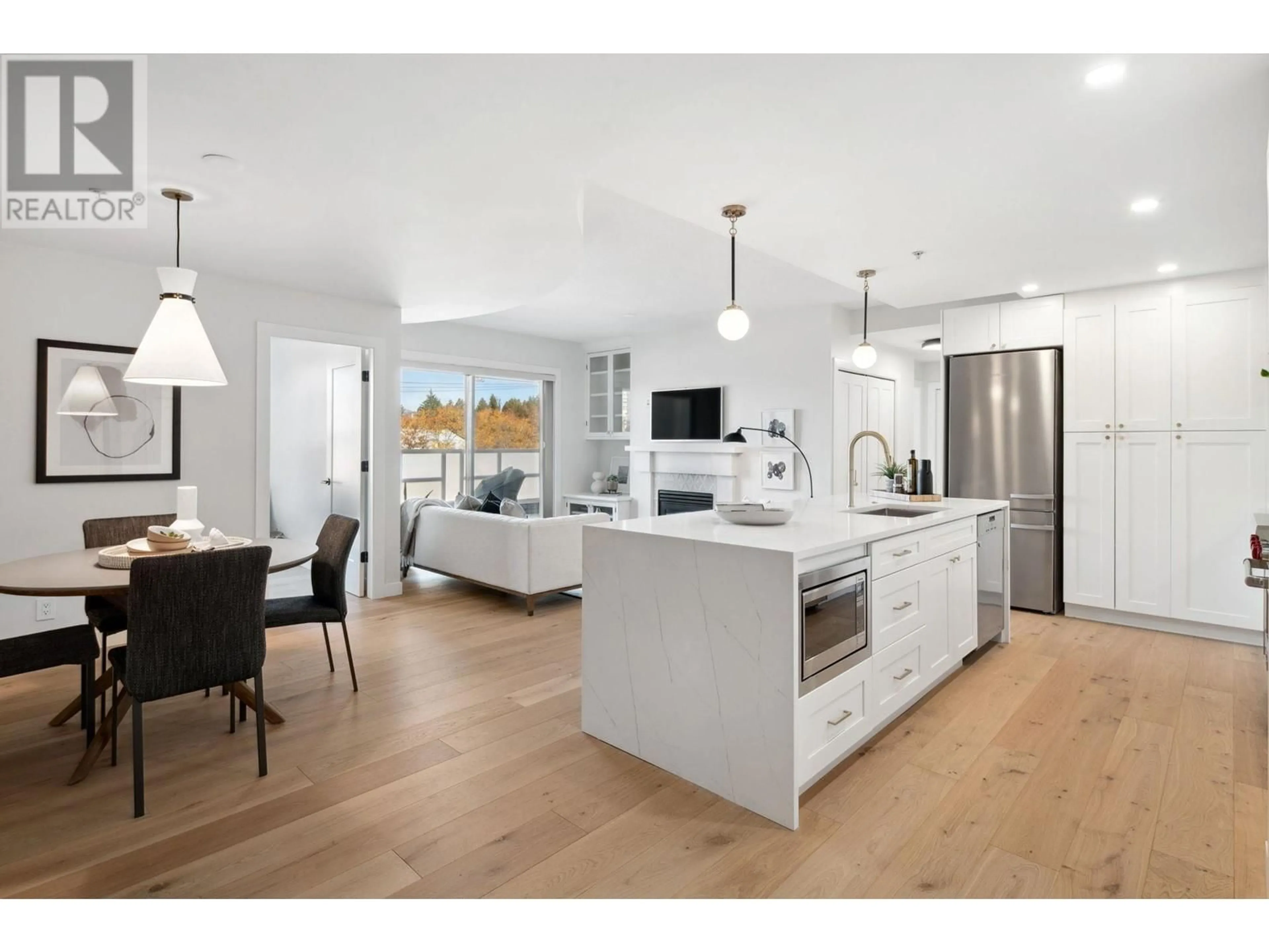 Open concept kitchen, wood/laminate floor for 402 5790 E BOULEVARD, Vancouver British Columbia V6M4M4