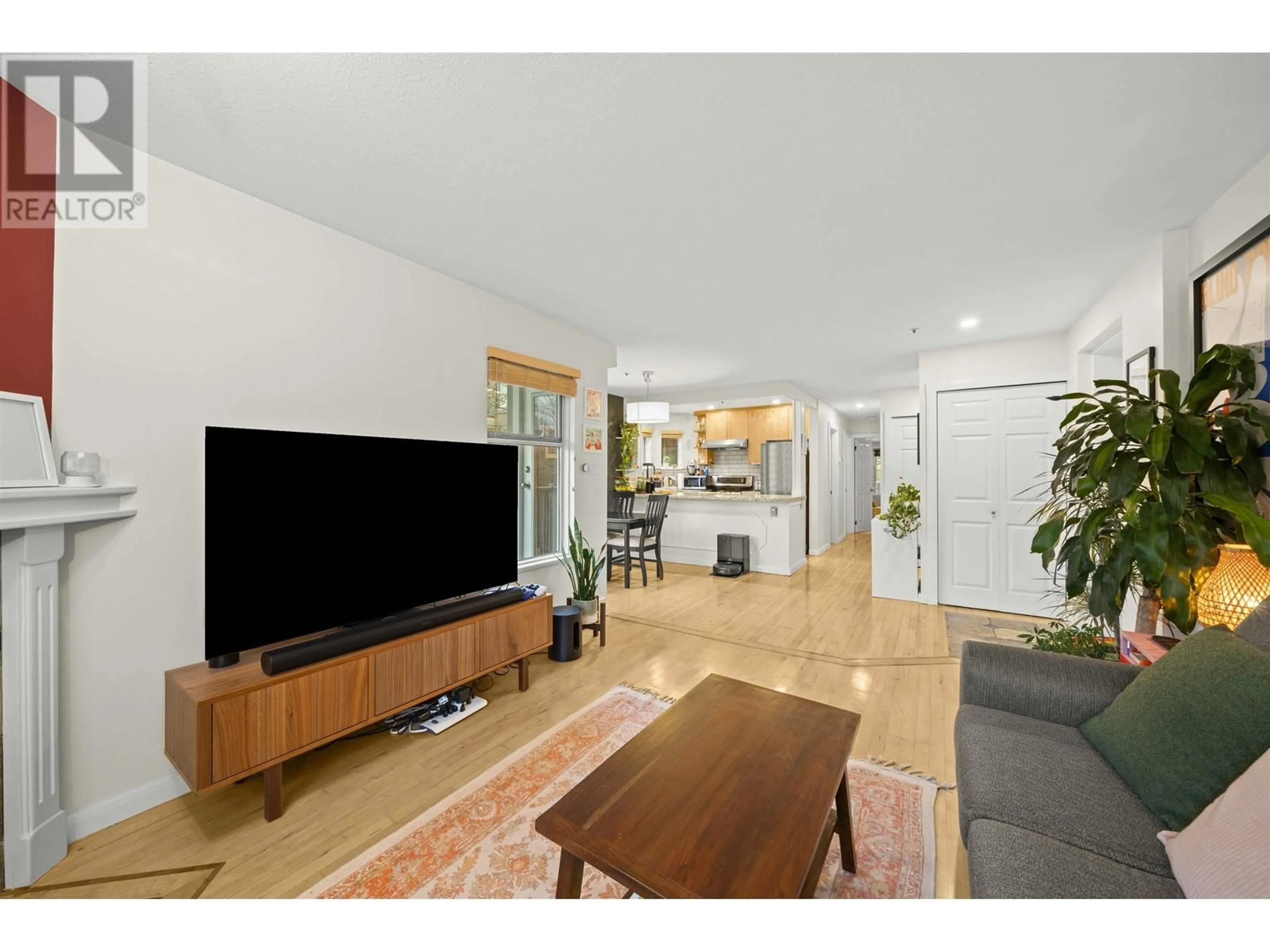 Living room with furniture, wood/laminate floor for 201 1868 W 8TH AVENUE, Vancouver British Columbia V6J5G3