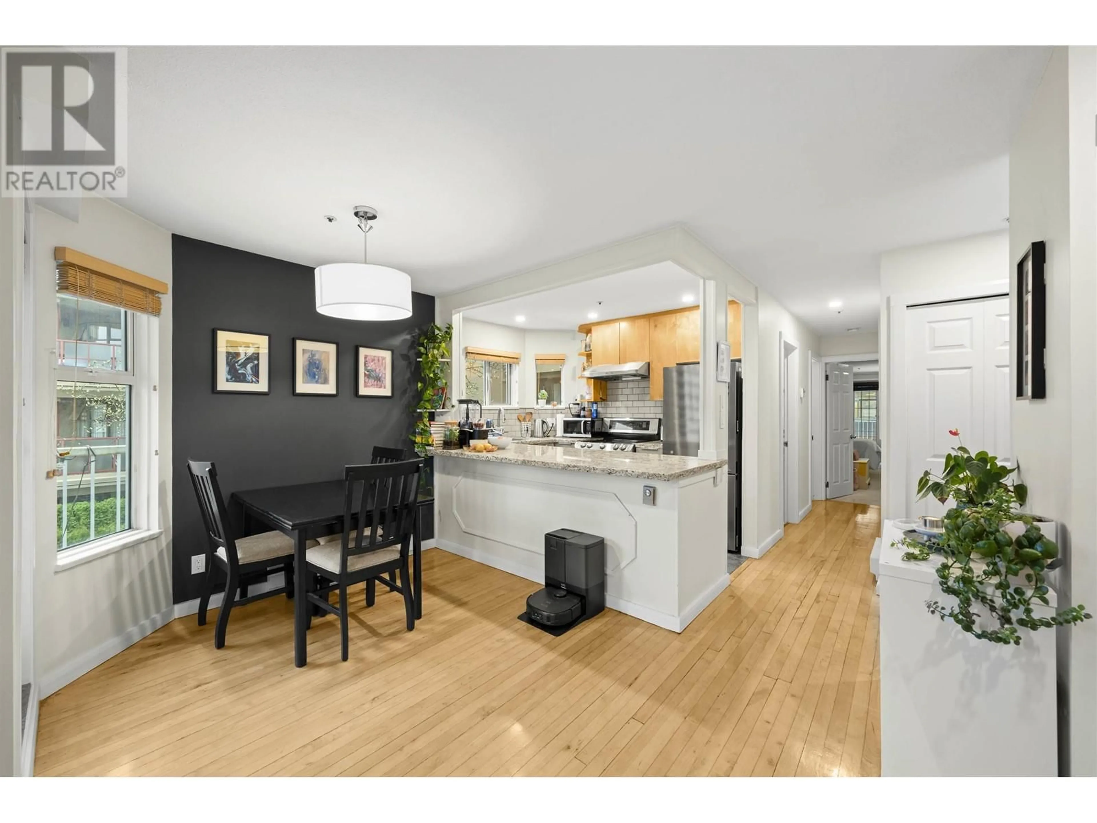 Open concept kitchen, wood/laminate floor for 201 1868 W 8TH AVENUE, Vancouver British Columbia V6J5G3