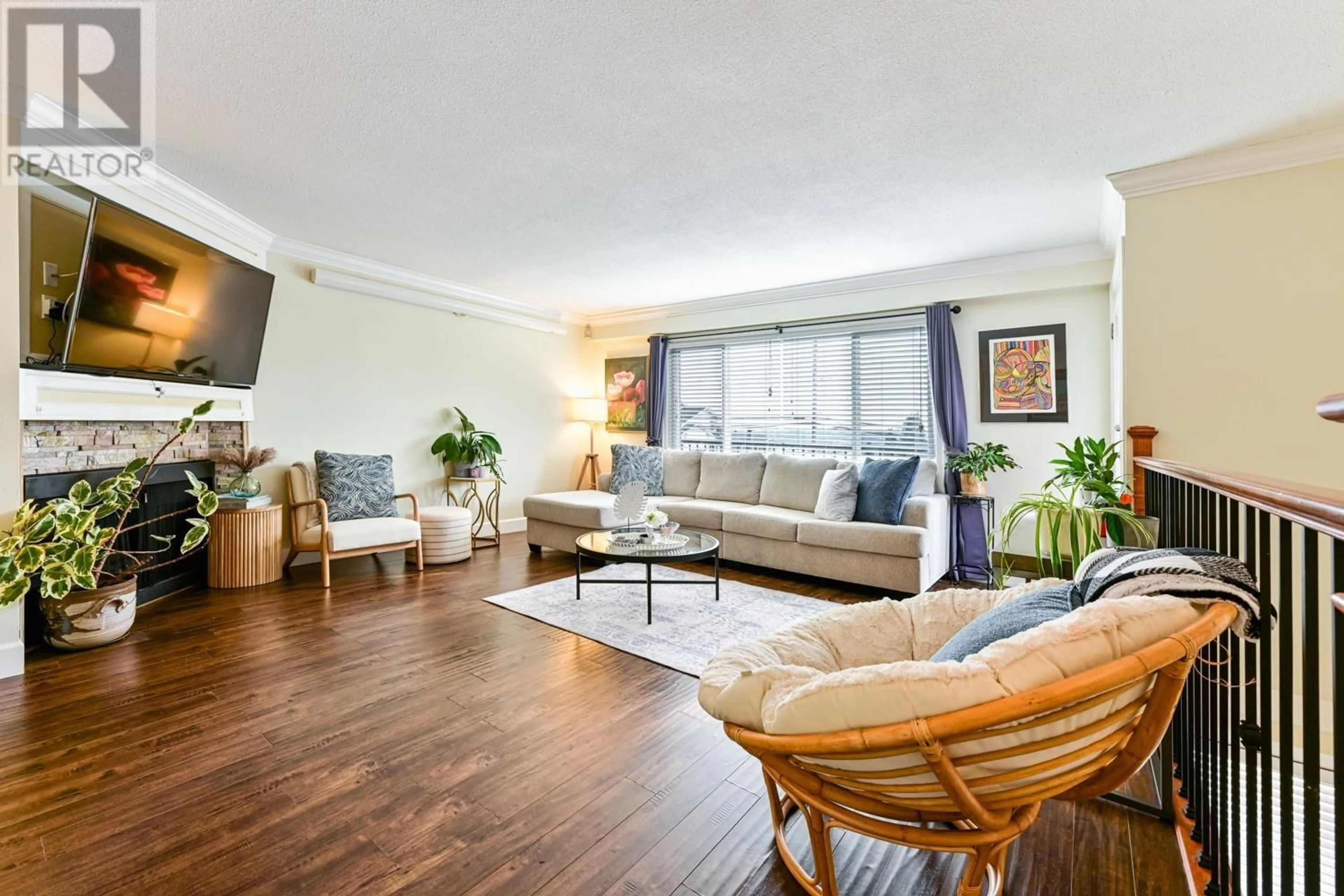 Living room with furniture, wood/laminate floor for 2097 - 2099 DAWES HILL ROAD, Coquitlam British Columbia V3K1M8