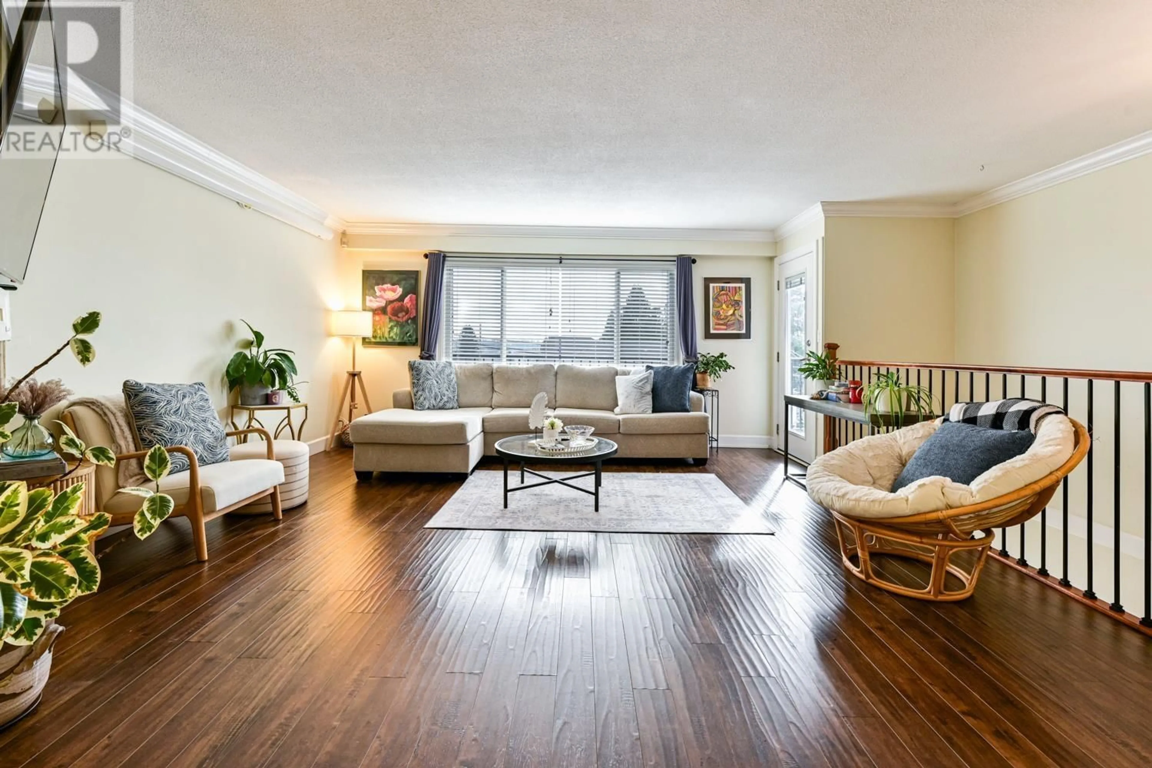 Living room with furniture, wood/laminate floor for 2097 - 2099 DAWES HILL ROAD, Coquitlam British Columbia V3K1M8