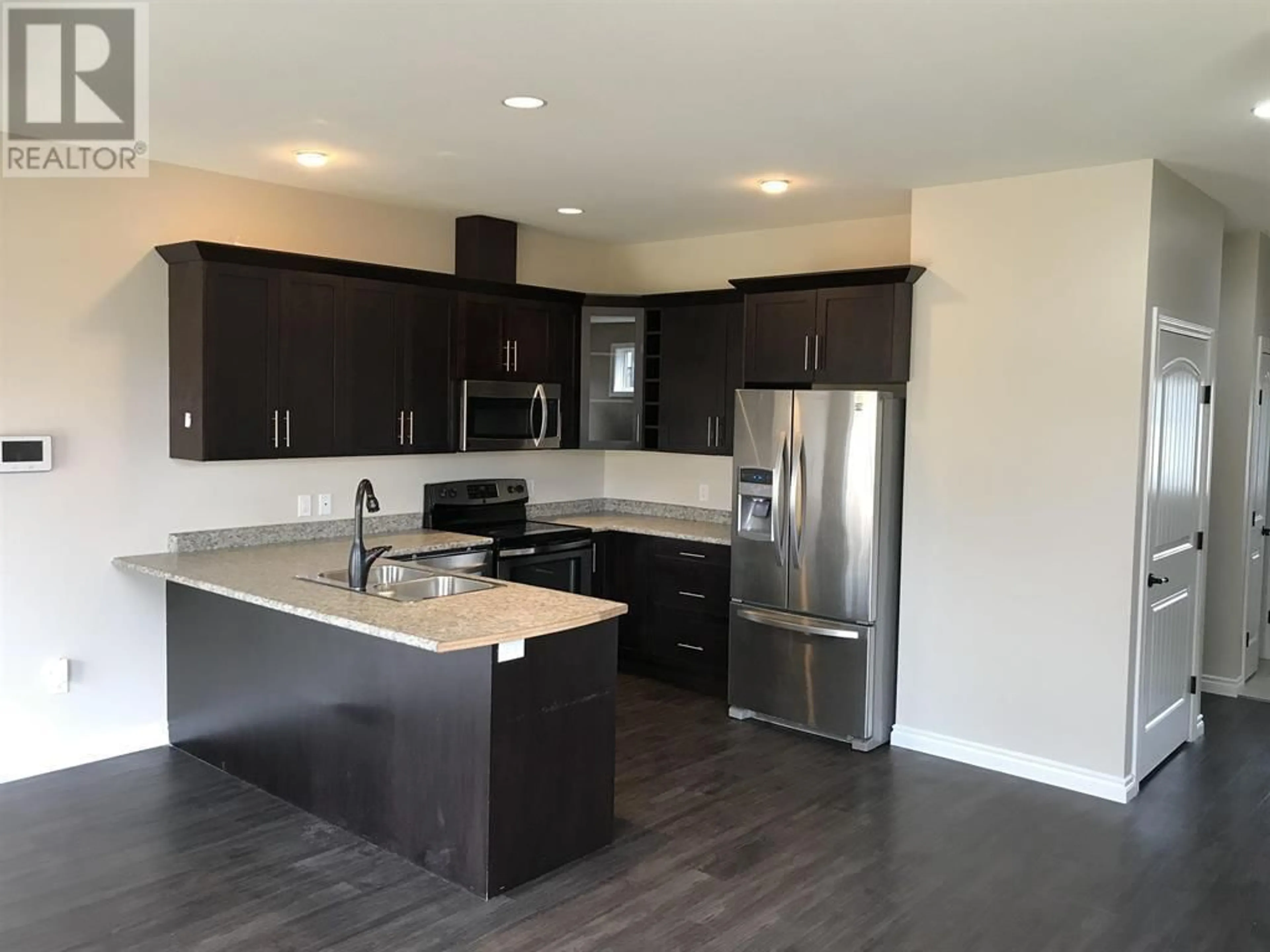 Open concept kitchen, unknown for 8314 87 AVENUE, Fort St. John British Columbia V1J0K8