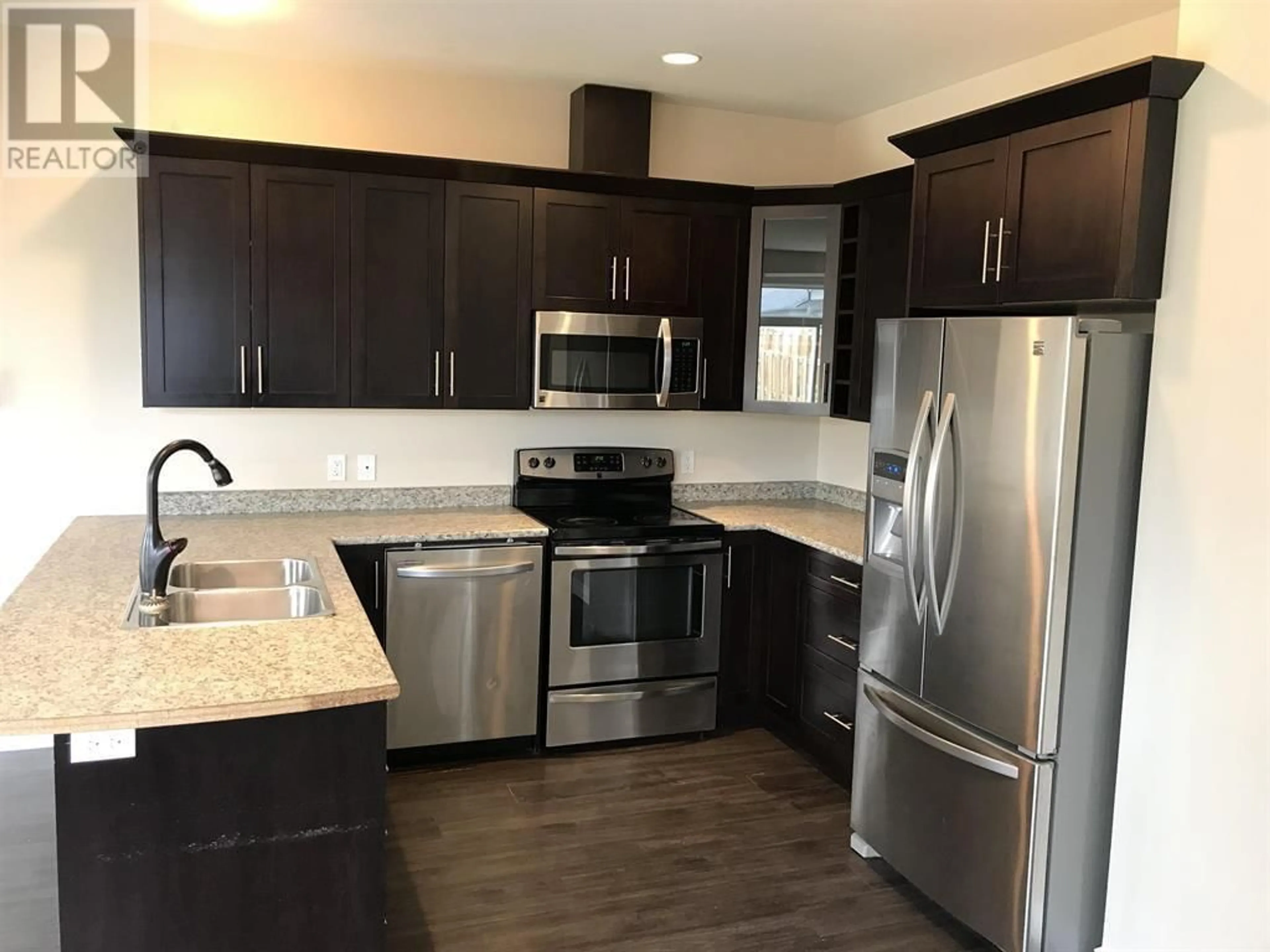 Open concept kitchen, unknown for 8314 87 AVENUE, Fort St. John British Columbia V1J0K8