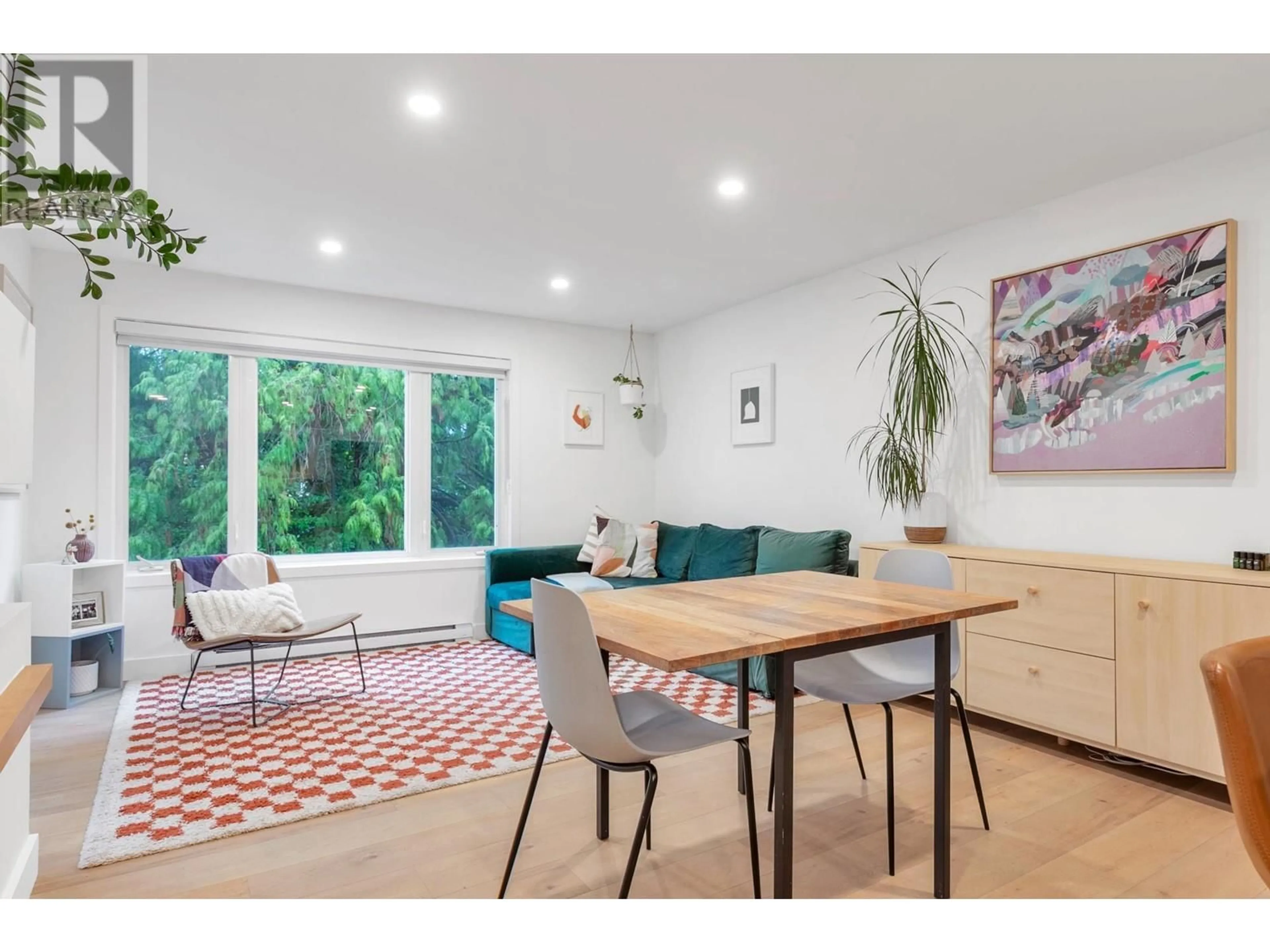 Living room with furniture, wood/laminate floor for 308 1060 E BROADWAY, Vancouver British Columbia V5T4N7