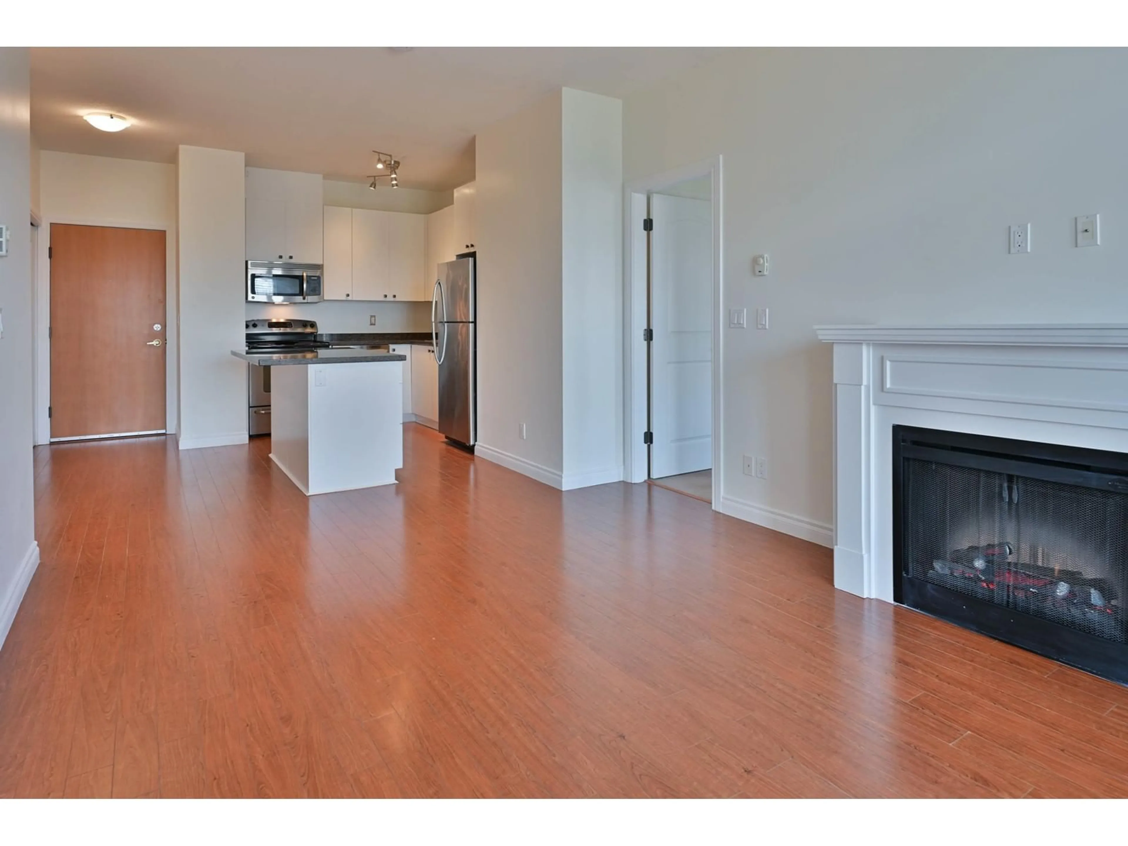 Open concept kitchen, wood/laminate floor for 503 8717 160 STREET, Surrey British Columbia V4N5X7