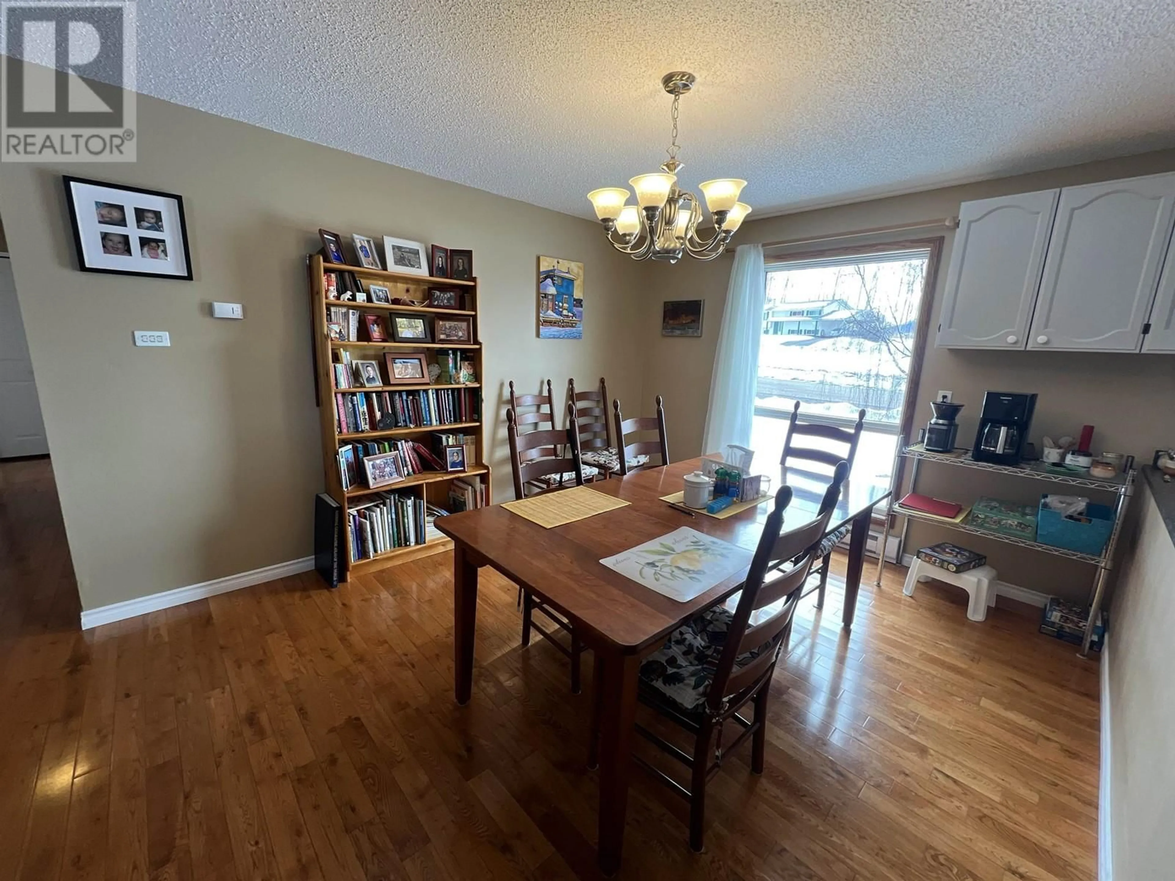 Dining room, wood/laminate floor for 551 SIMON FRASER AVENUE, Fraser Lake British Columbia V0J1S0