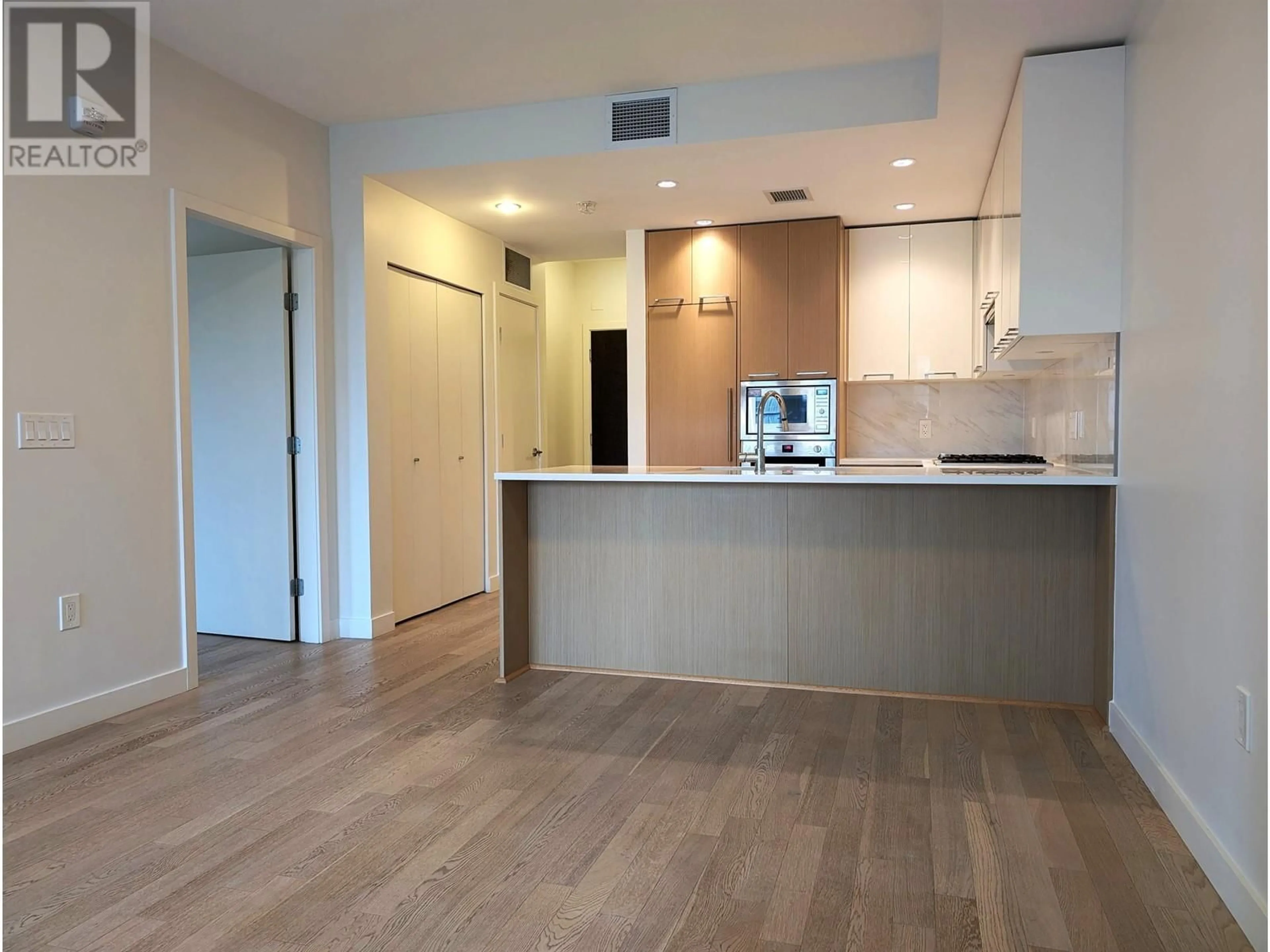 Open concept kitchen, wood/laminate floor for 315 - 4033 MAY DRIVE, Richmond British Columbia V6X0T3