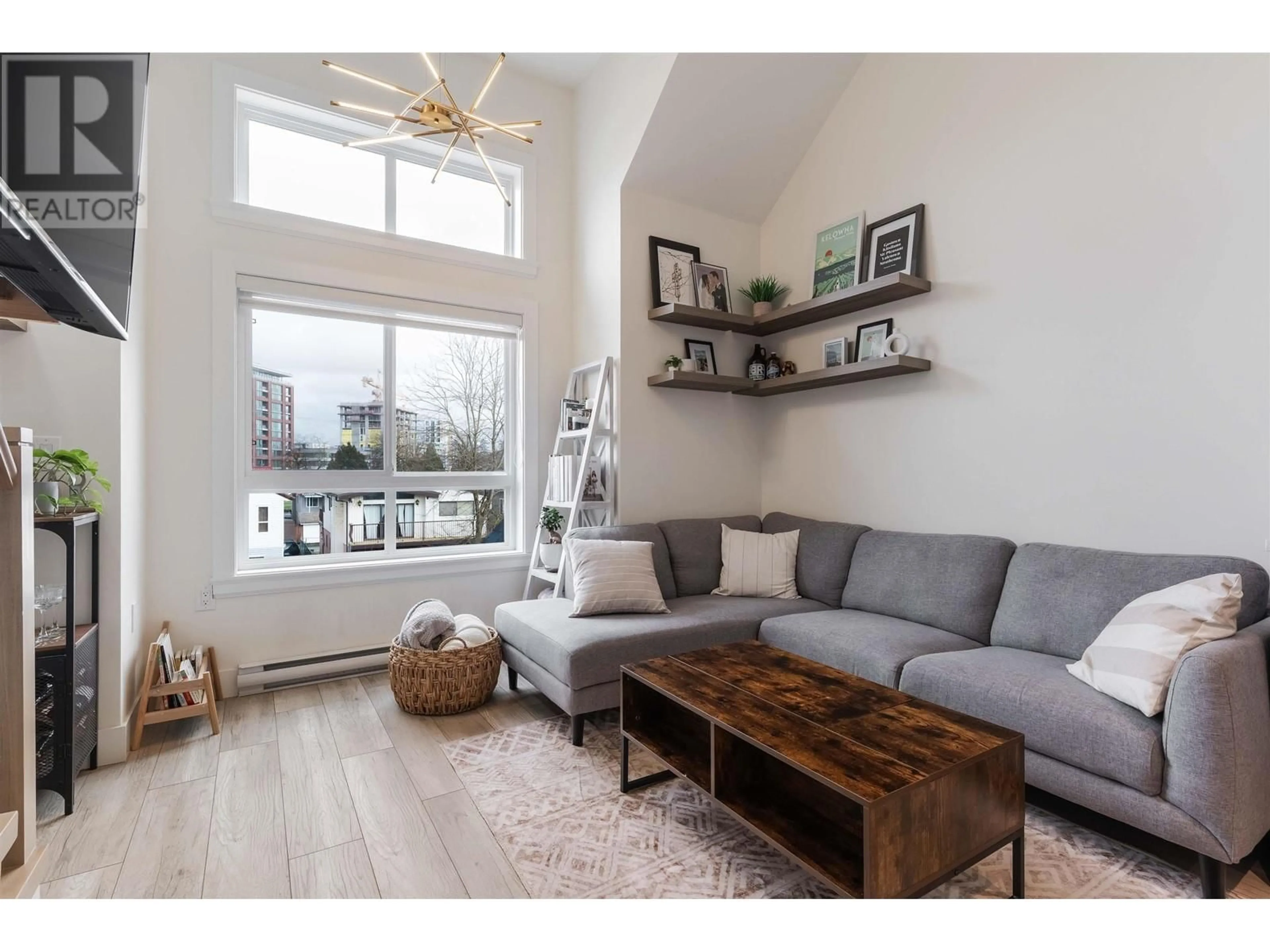 Living room with furniture, wood/laminate floor for 5009 CHAMBERS STREET, Vancouver British Columbia V5R3L8