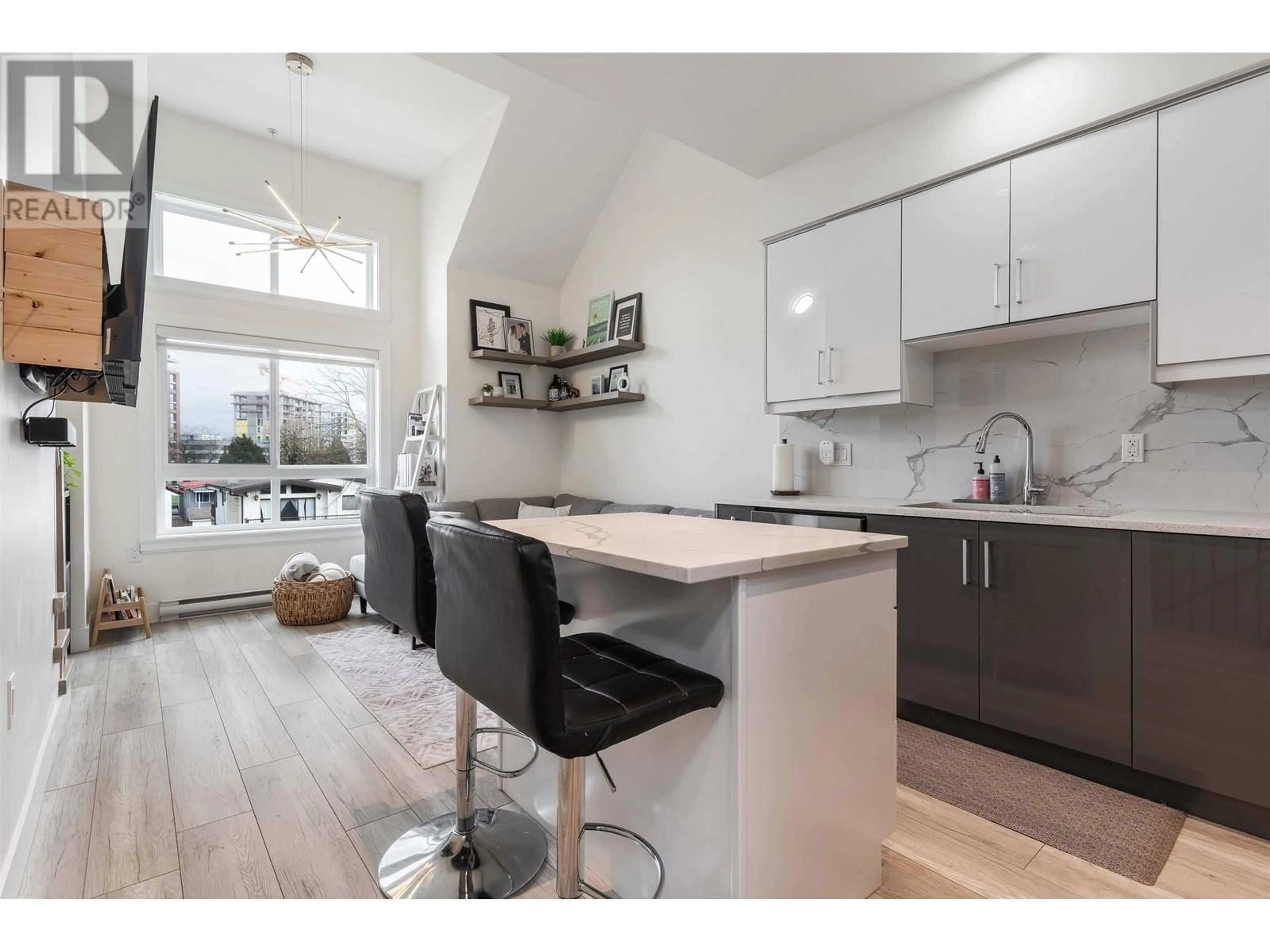 Open concept kitchen, wood/laminate floor for 5009 CHAMBERS STREET, Vancouver British Columbia V5R3L8