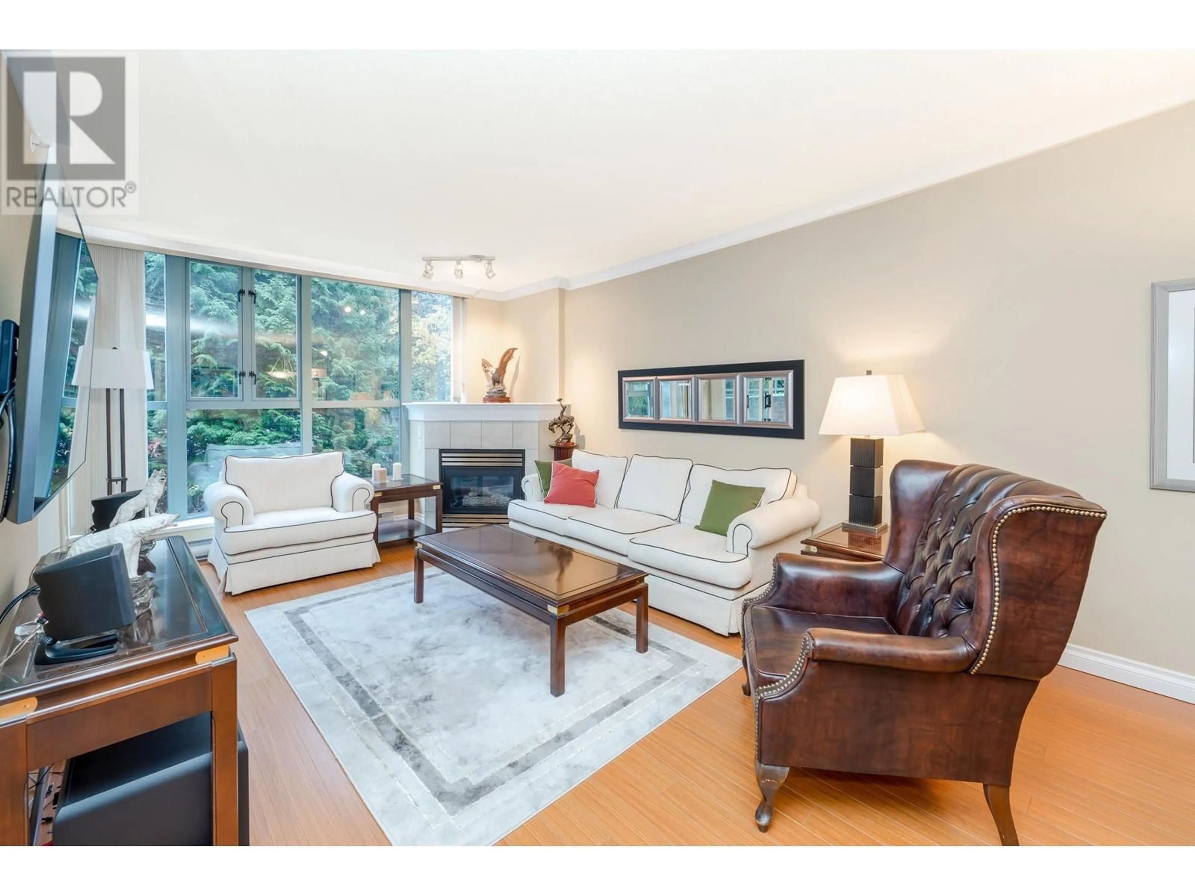 Living room with furniture, wood/laminate floor for 202 - 200 NEWPORT DRIVE, Port Moody British Columbia V3H5B7