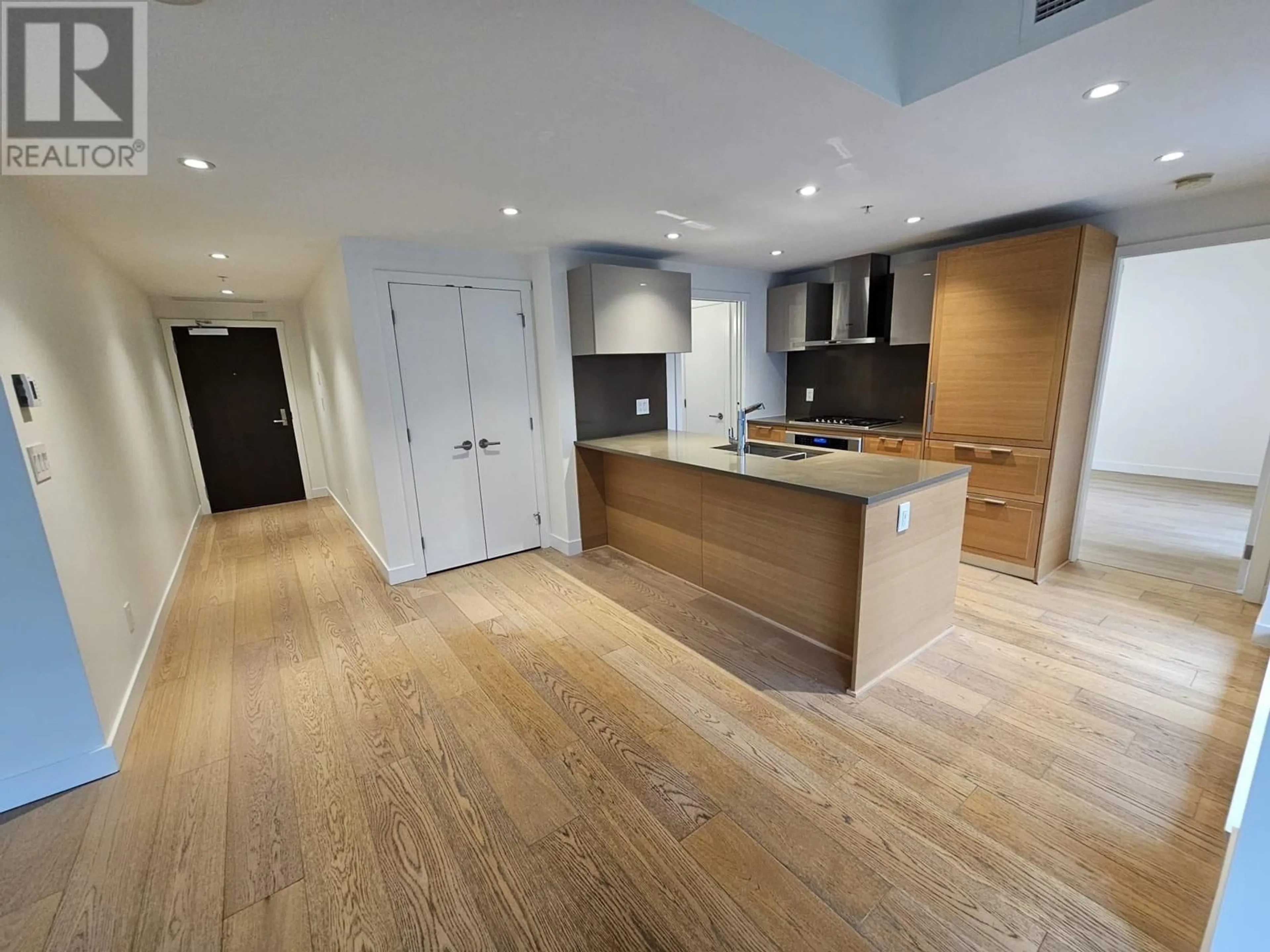 Open concept kitchen, wood/laminate floor for 513 - 7128 ADERA STREET, Vancouver British Columbia V6P5C4