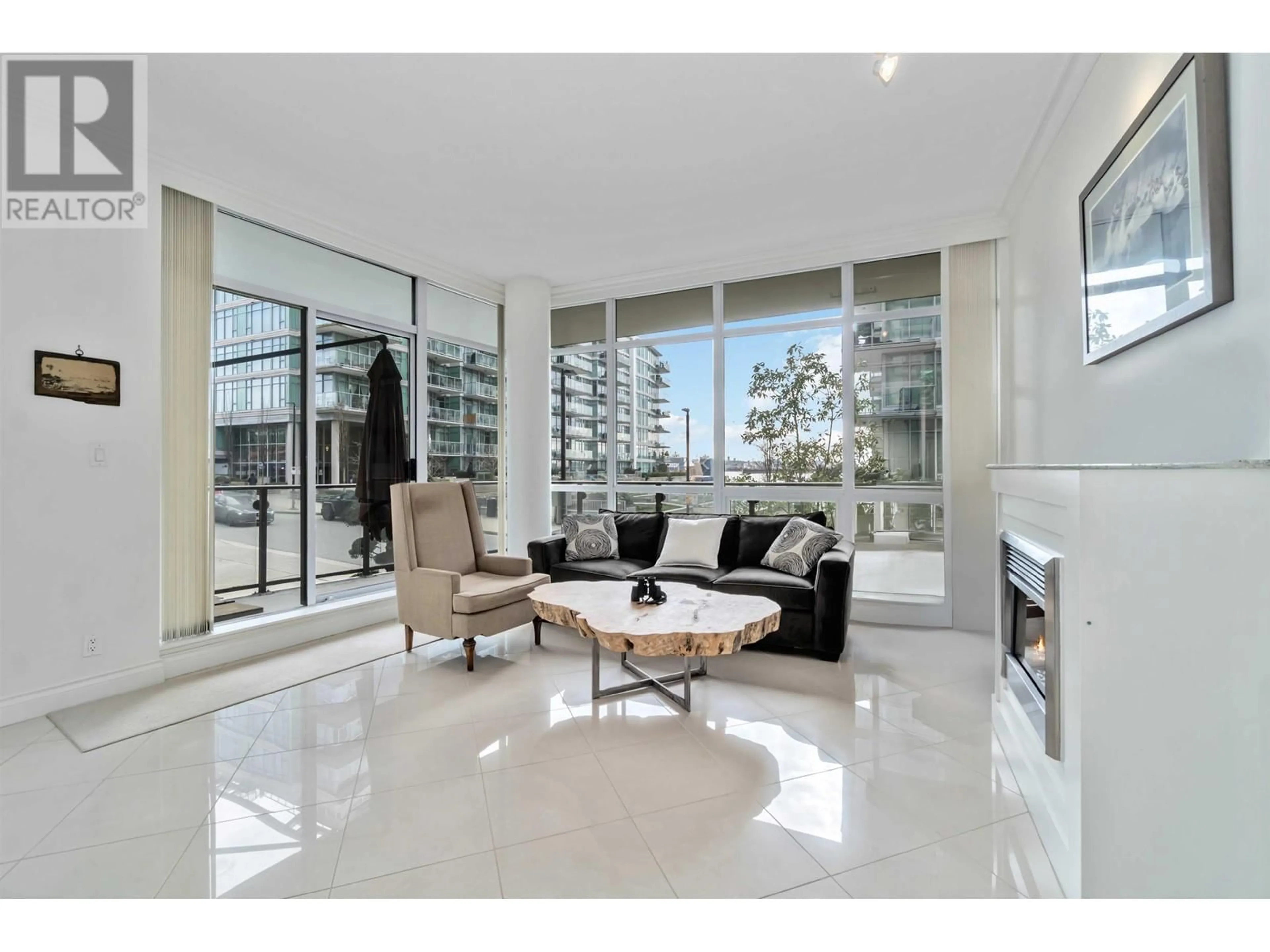 Living room with furniture, ceramic/tile floor for 201 - 162 VICTORY SHIP WAY, North Vancouver British Columbia V7L0B4