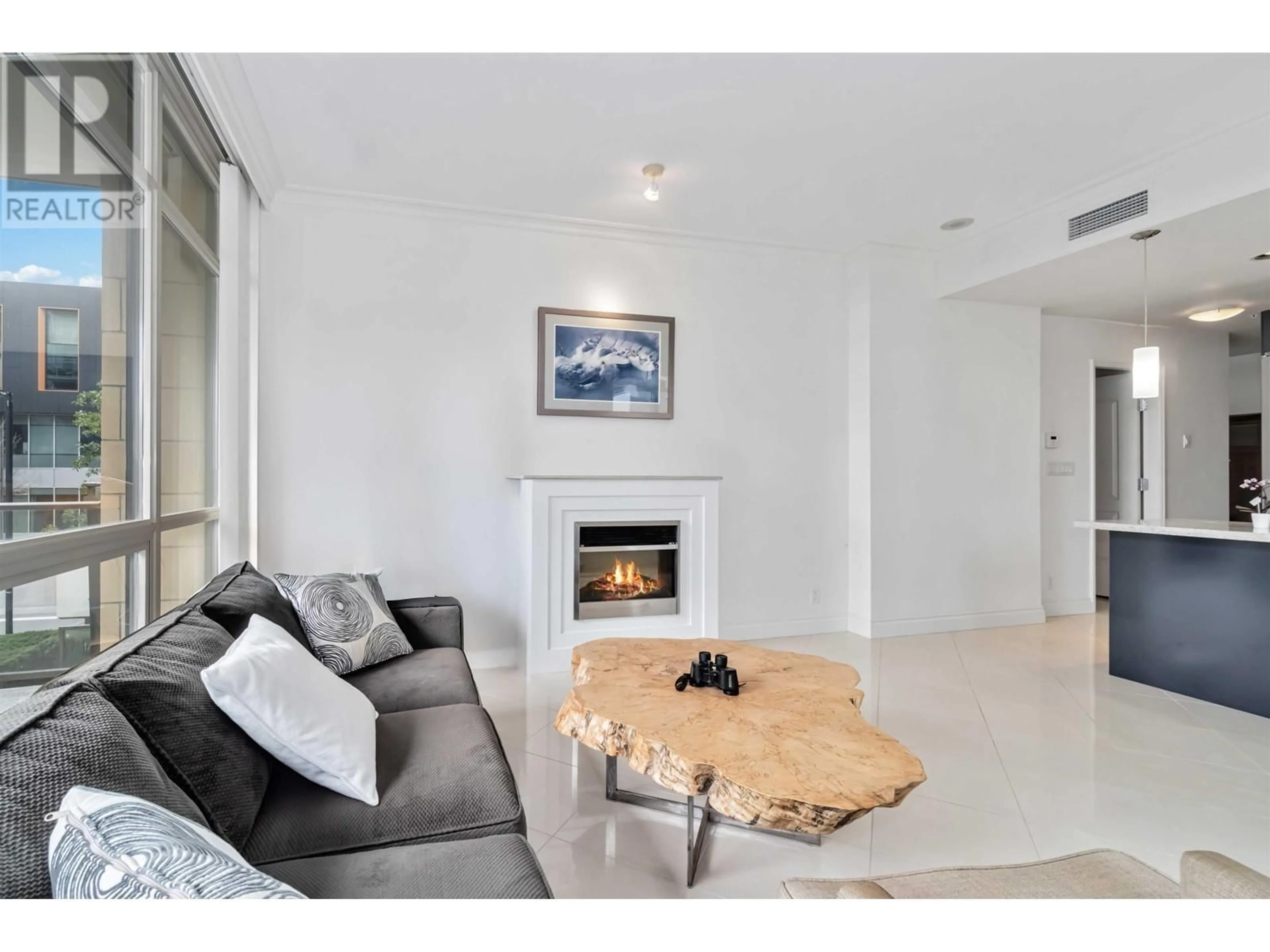 Living room with furniture, unknown for 201 - 162 VICTORY SHIP WAY, North Vancouver British Columbia V7L0B4