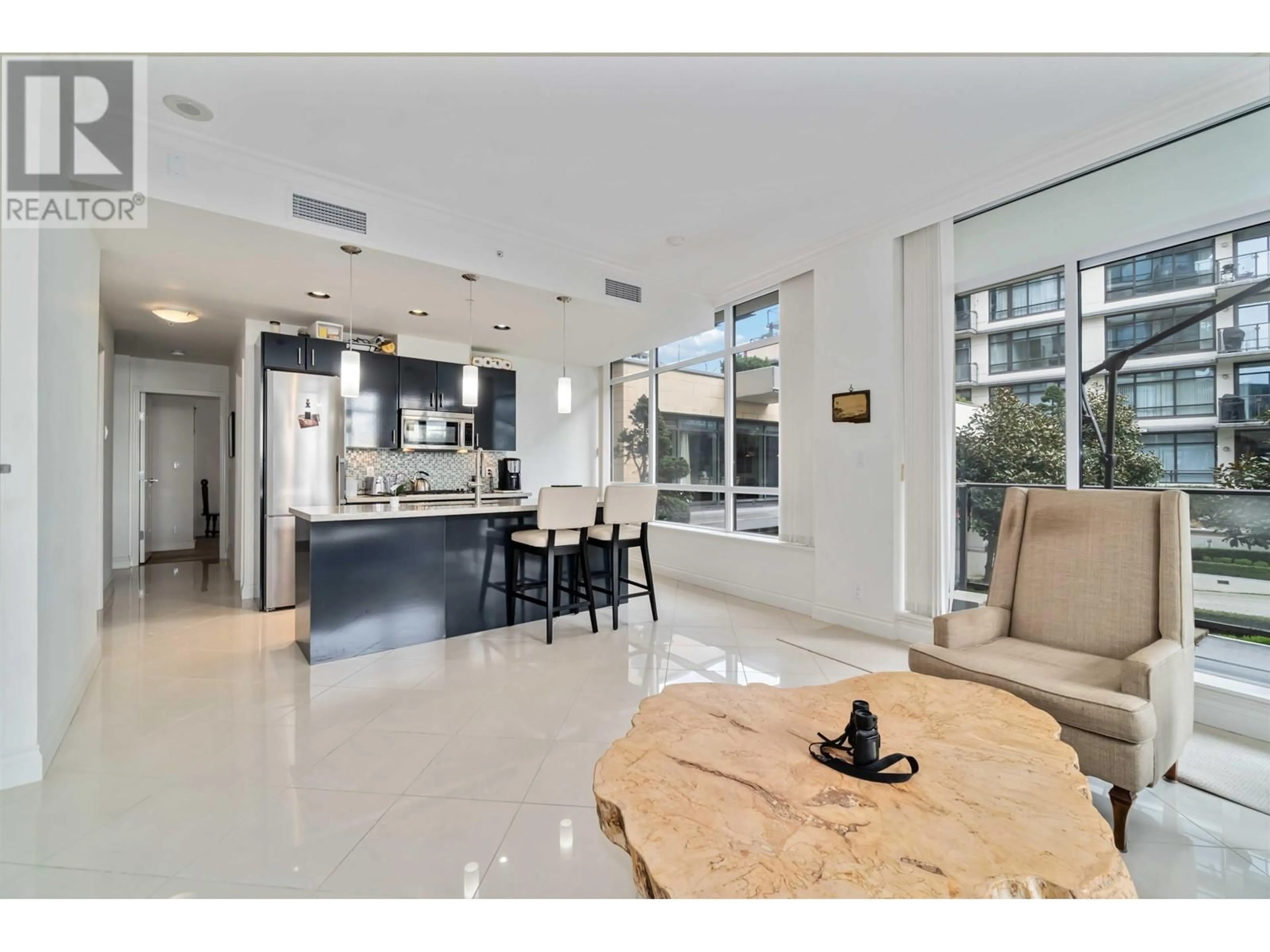 Open concept kitchen, ceramic/tile floor for 201 - 162 VICTORY SHIP WAY, North Vancouver British Columbia V7L0B4