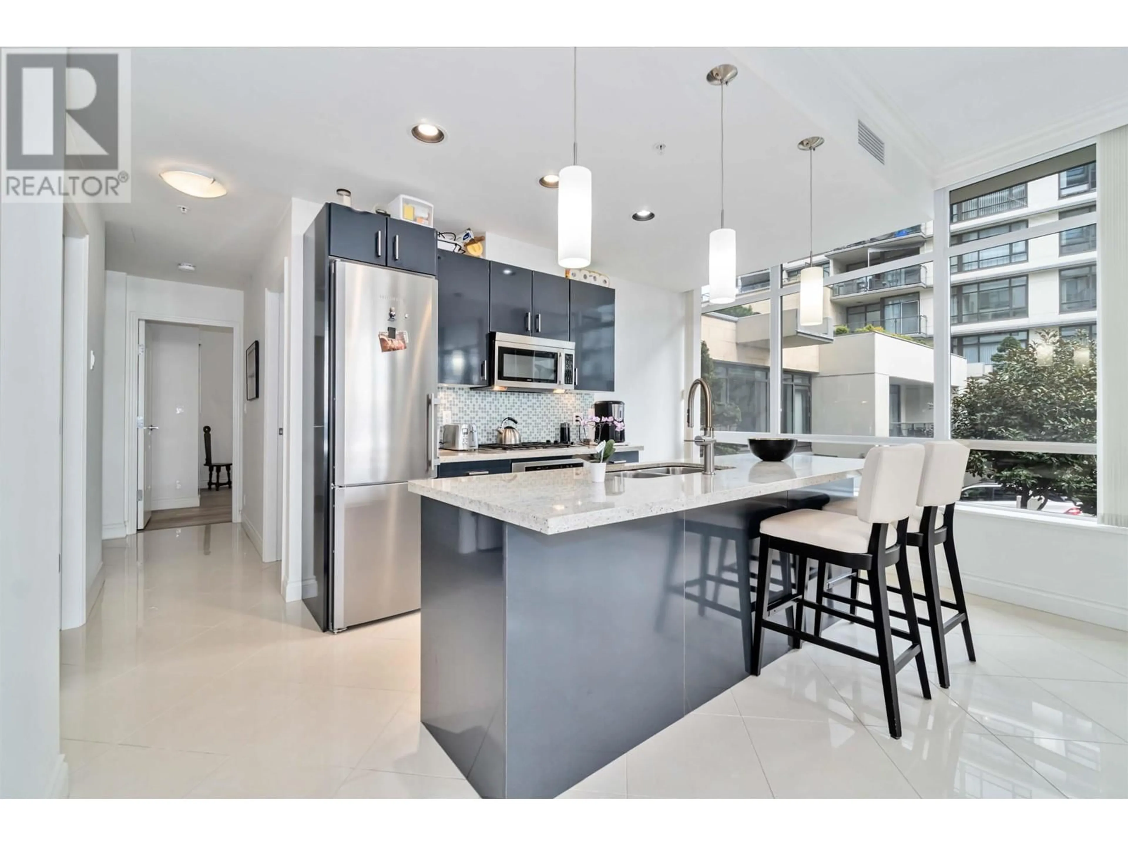 Contemporary kitchen, ceramic/tile floor for 201 - 162 VICTORY SHIP WAY, North Vancouver British Columbia V7L0B4