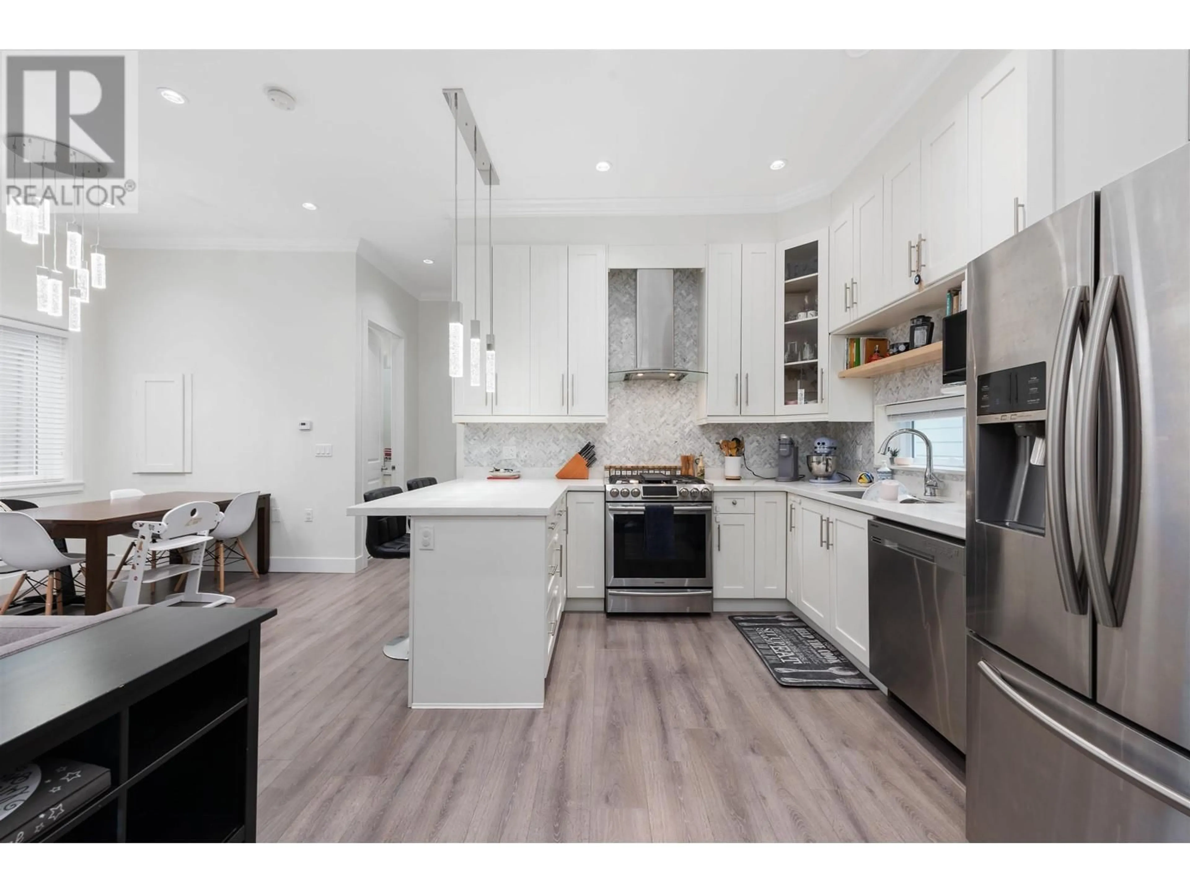 Open concept kitchen, wood/laminate floor for 5485 DUNDEE STREET, Vancouver British Columbia V5R3T8