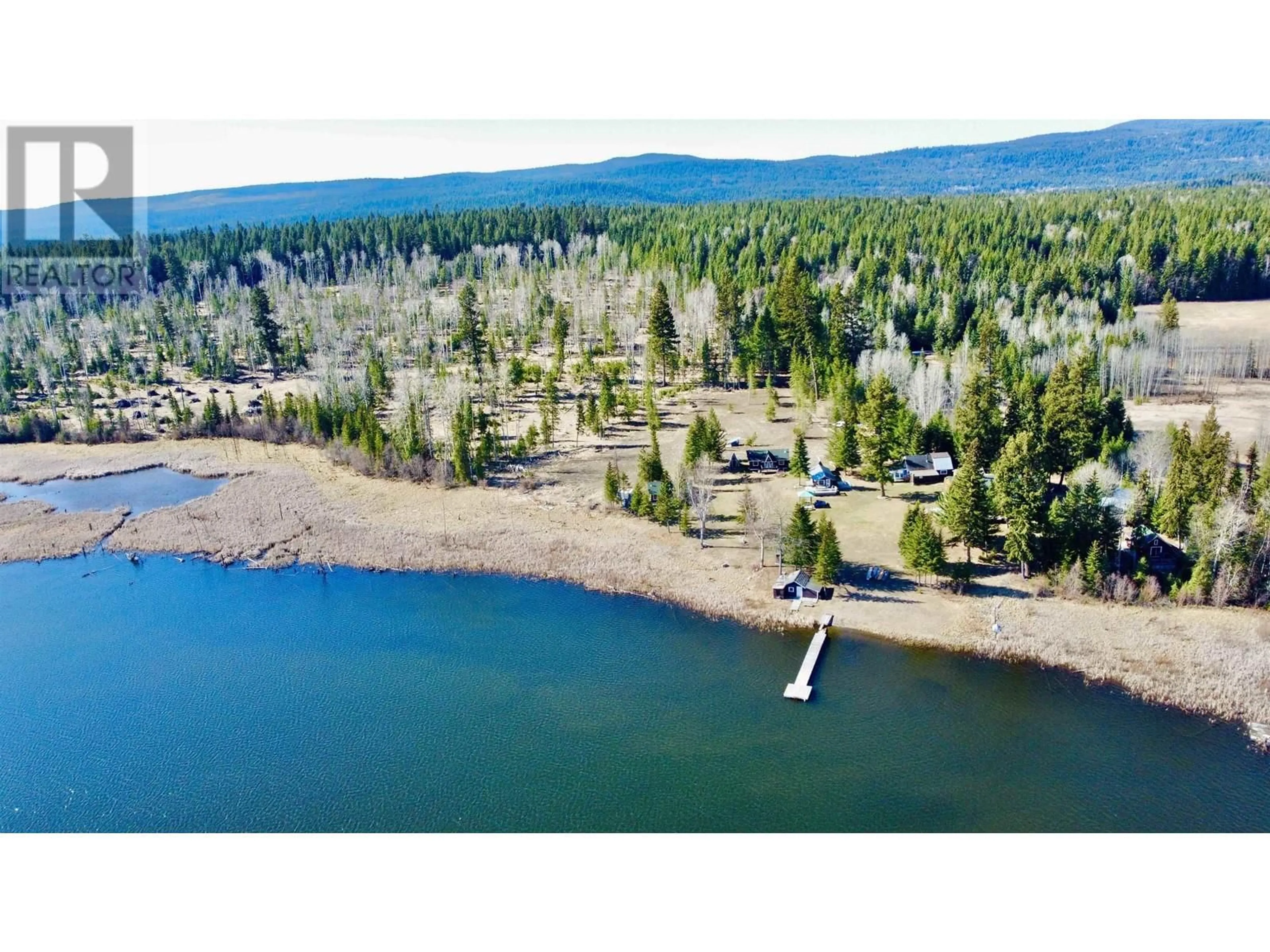 A pic from outside/outdoor area/front of a property/back of a property/a pic from drone, water/lake/river/ocean view for 5873 DEMPSEY LAKE ROAD, Lac La Hache British Columbia V0K1M0