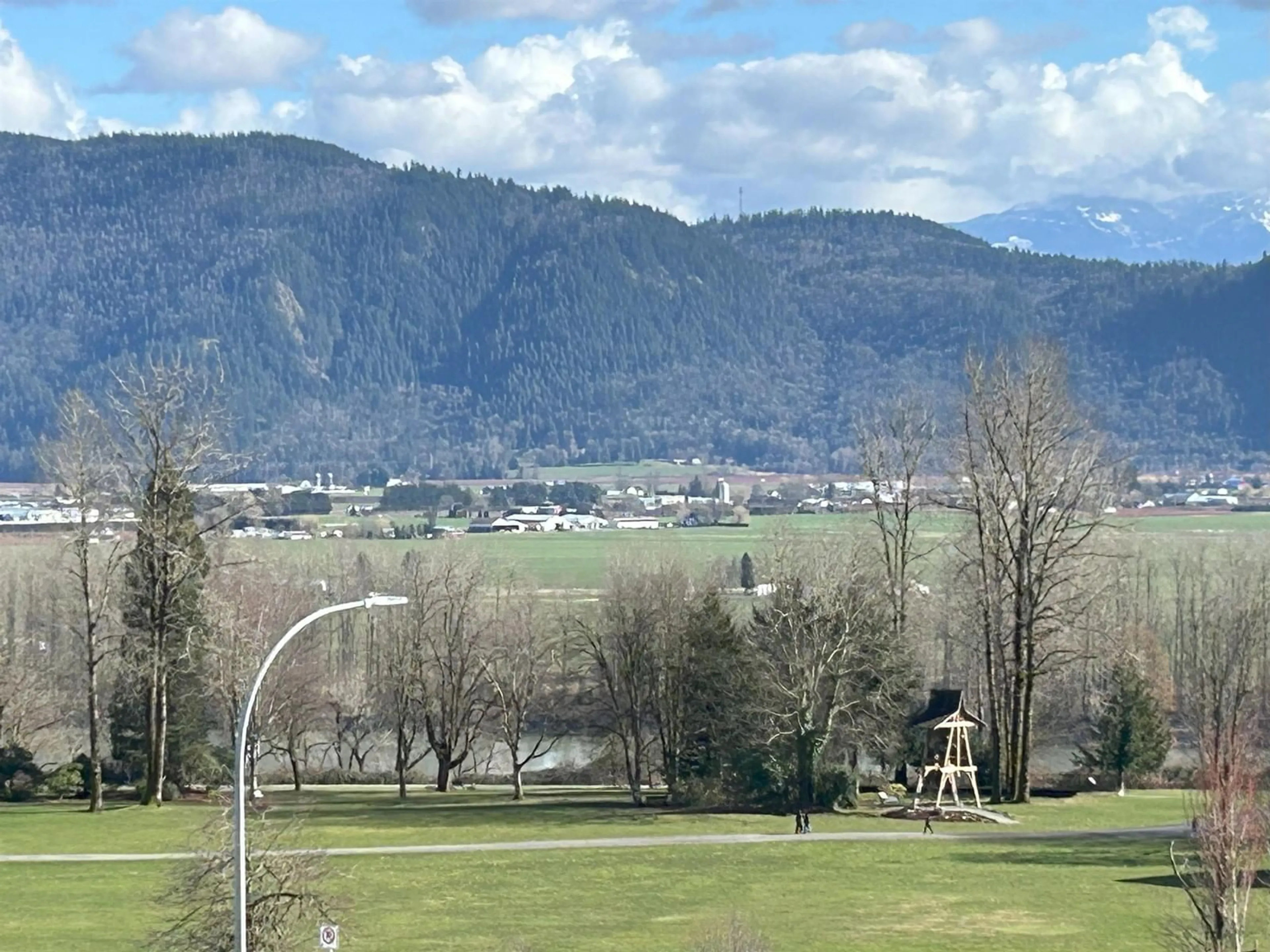 A pic from outside/outdoor area/front of a property/back of a property/a pic from drone, mountain view for A314 - 33755 7TH, Mission British Columbia V2V0A4