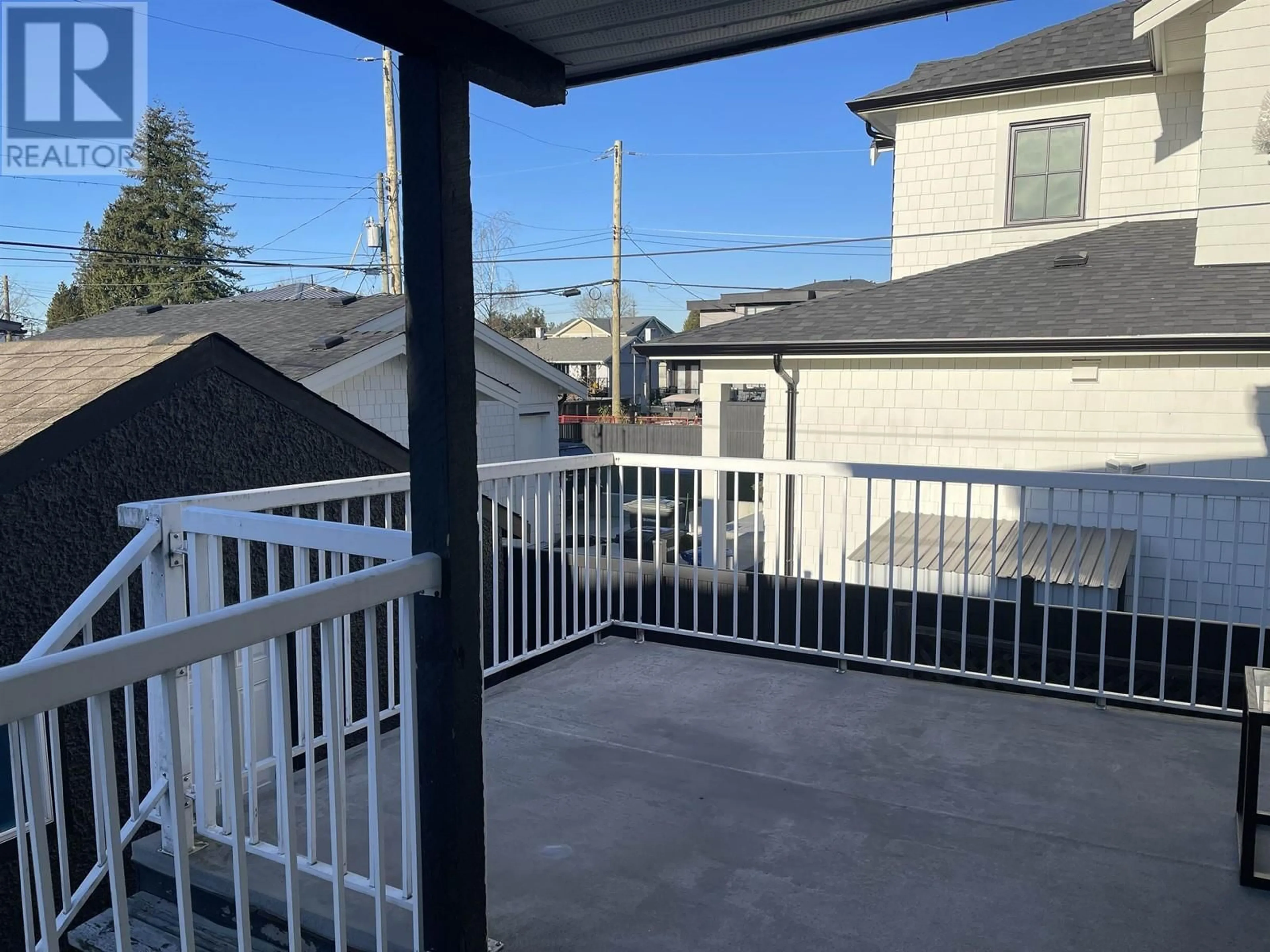 Patio, city buildings view from balcony for 6655 STRATHMORE AVENUE, Burnaby British Columbia V5E3H8