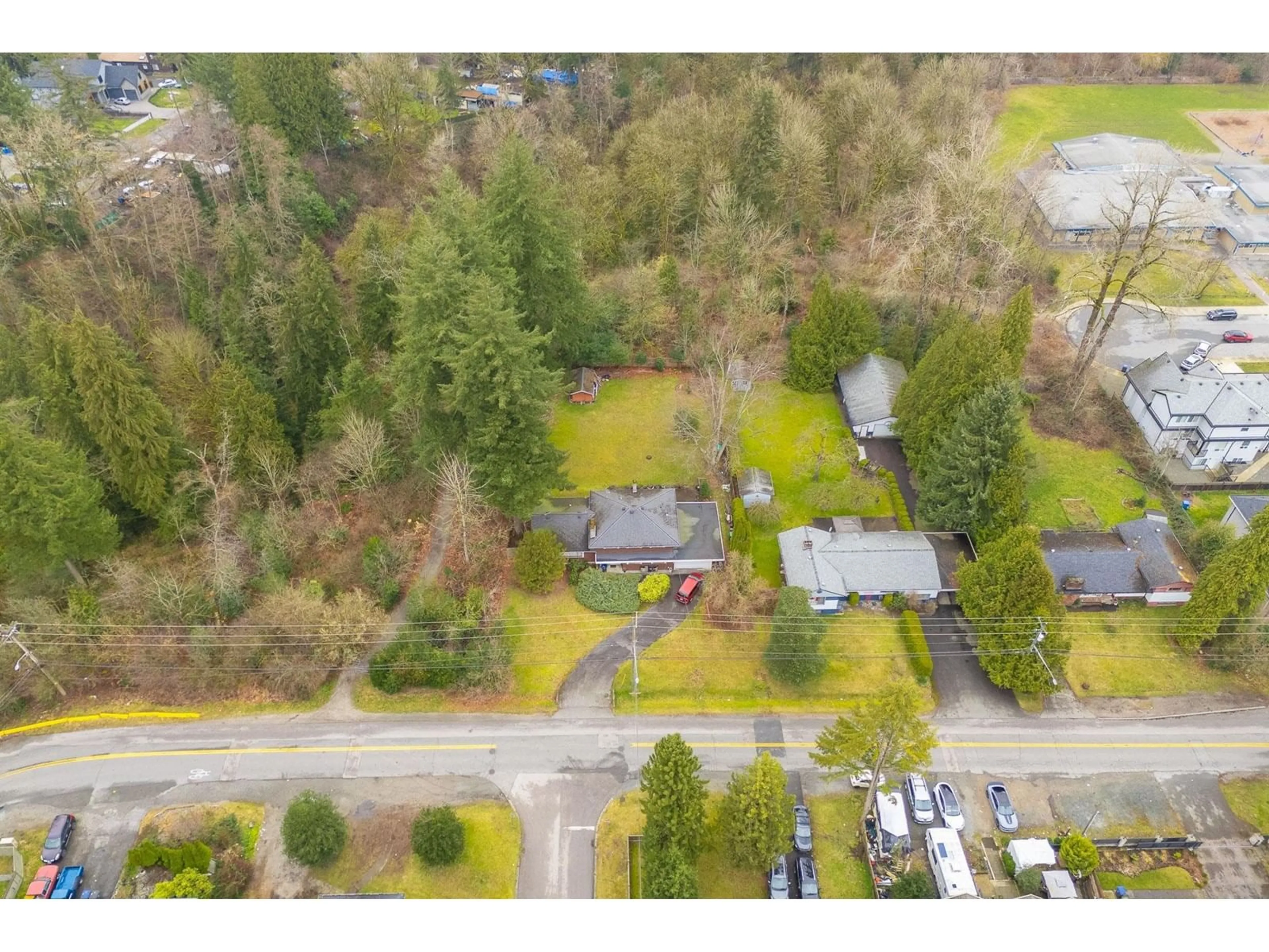 A pic from outside/outdoor area/front of a property/back of a property/a pic from drone, street for 14457 110 AVENUE, Surrey British Columbia V3R2A4