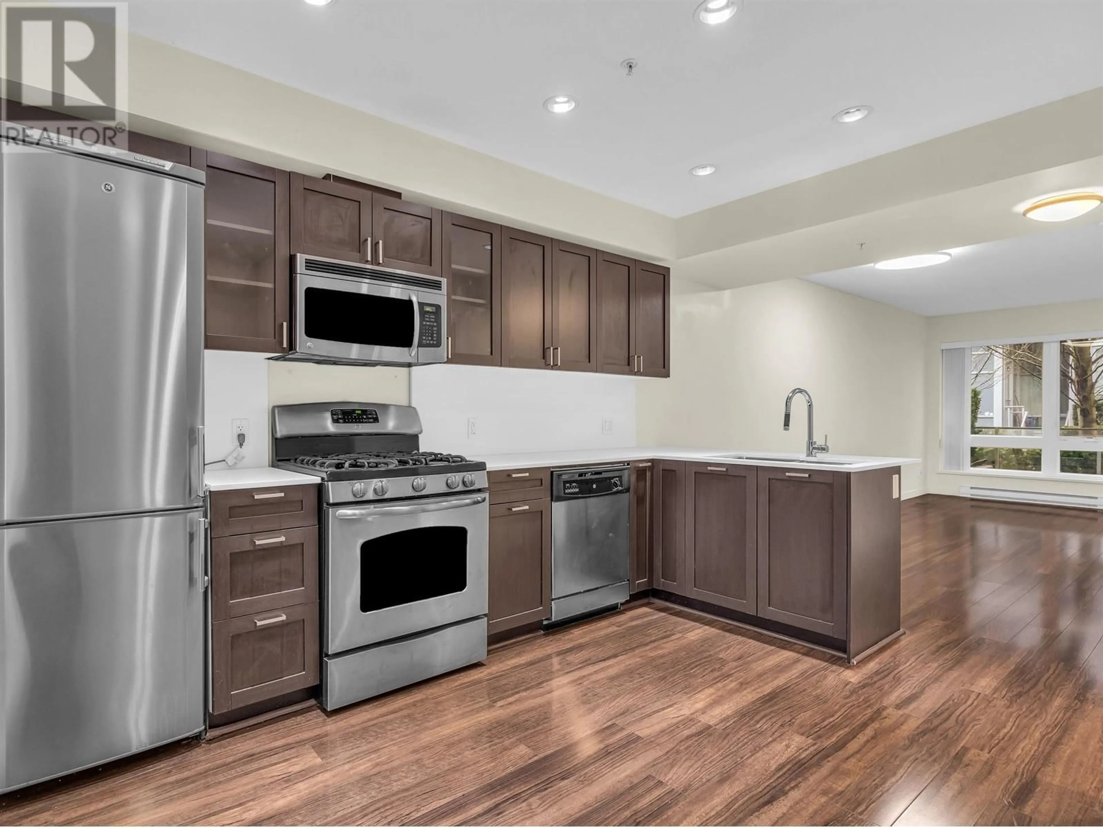 Open concept kitchen, wood/laminate floor for 4858 ELDORADO MEWS, Vancouver British Columbia V5R0B1