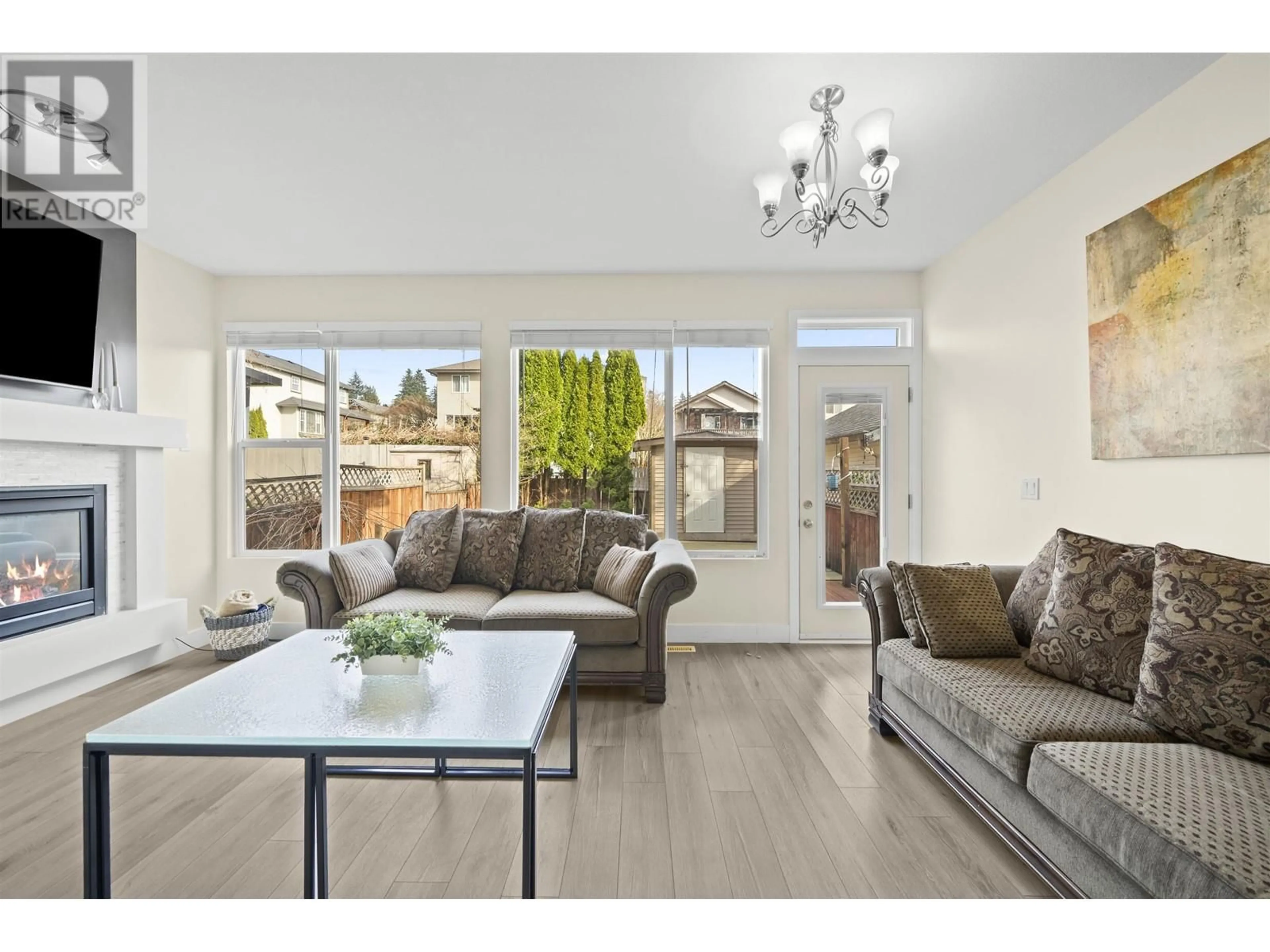 Living room with furniture, wood/laminate floor for 10292 242B STREET, Maple Ridge British Columbia V2W1Y1