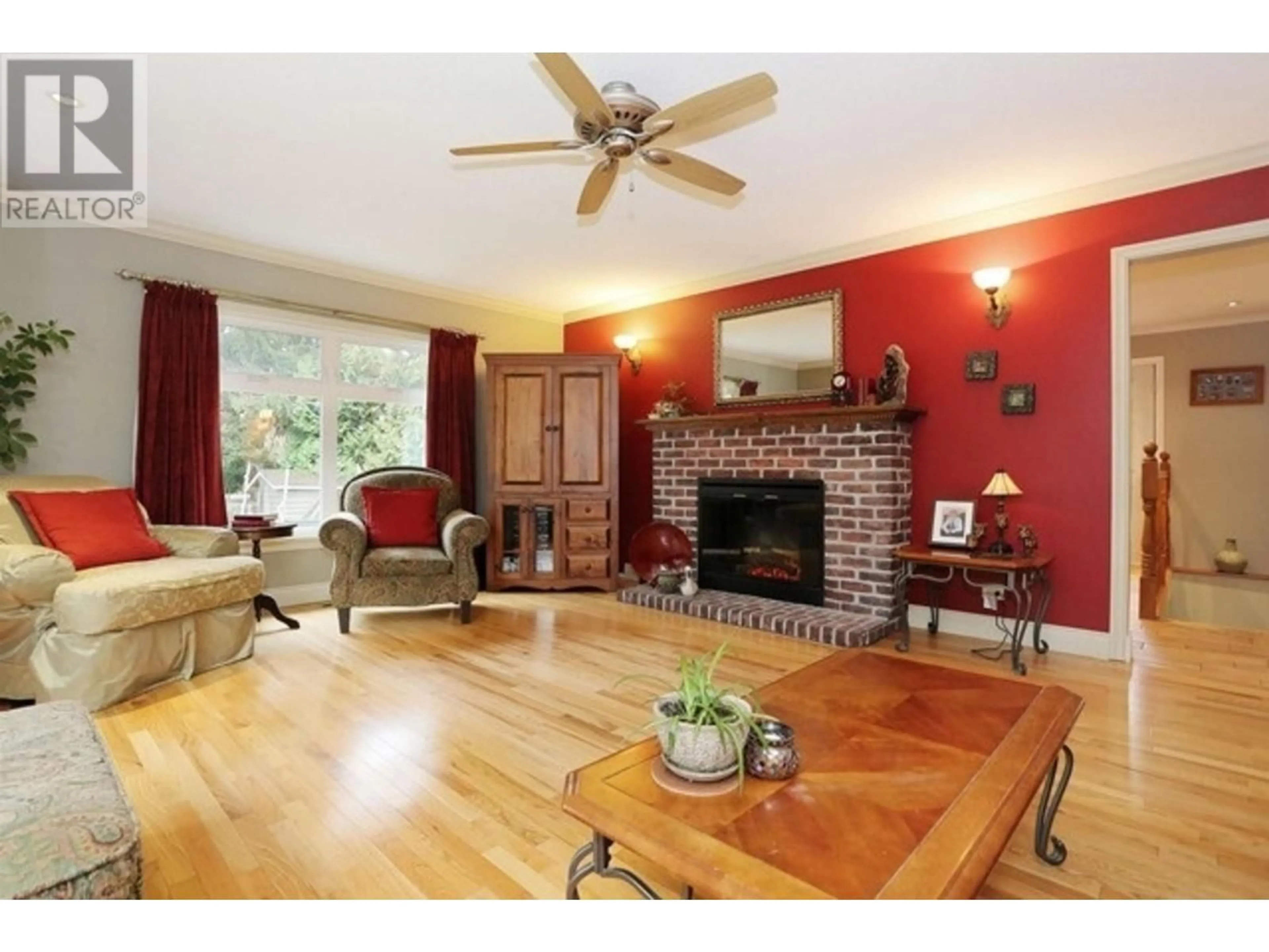 Living room with furniture, wood/laminate floor for 5214 12 AVENUE, Delta British Columbia V4M2A8