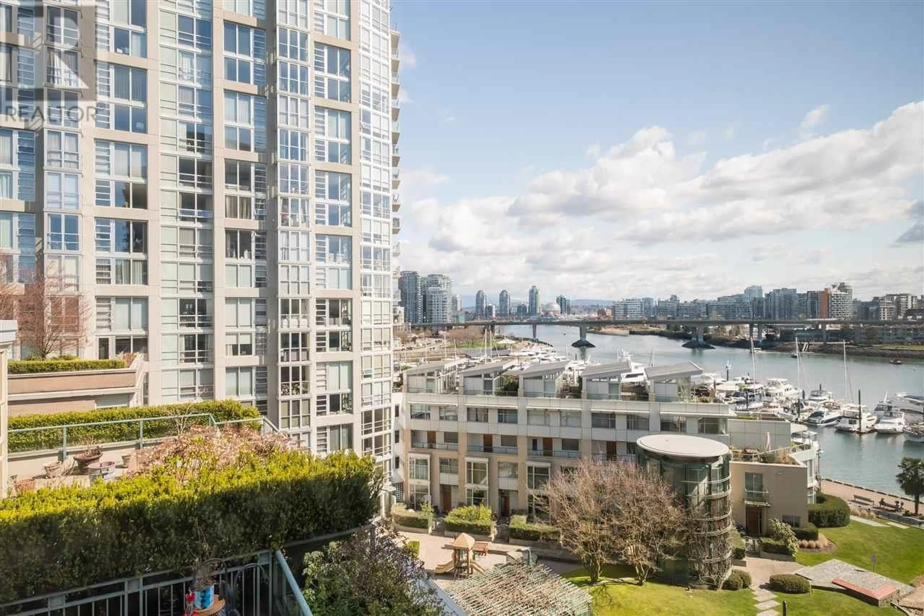 Patio, city buildings view from balcony for 907 - 1288 MARINASIDE CRESCENT, Vancouver British Columbia V6Z2W5