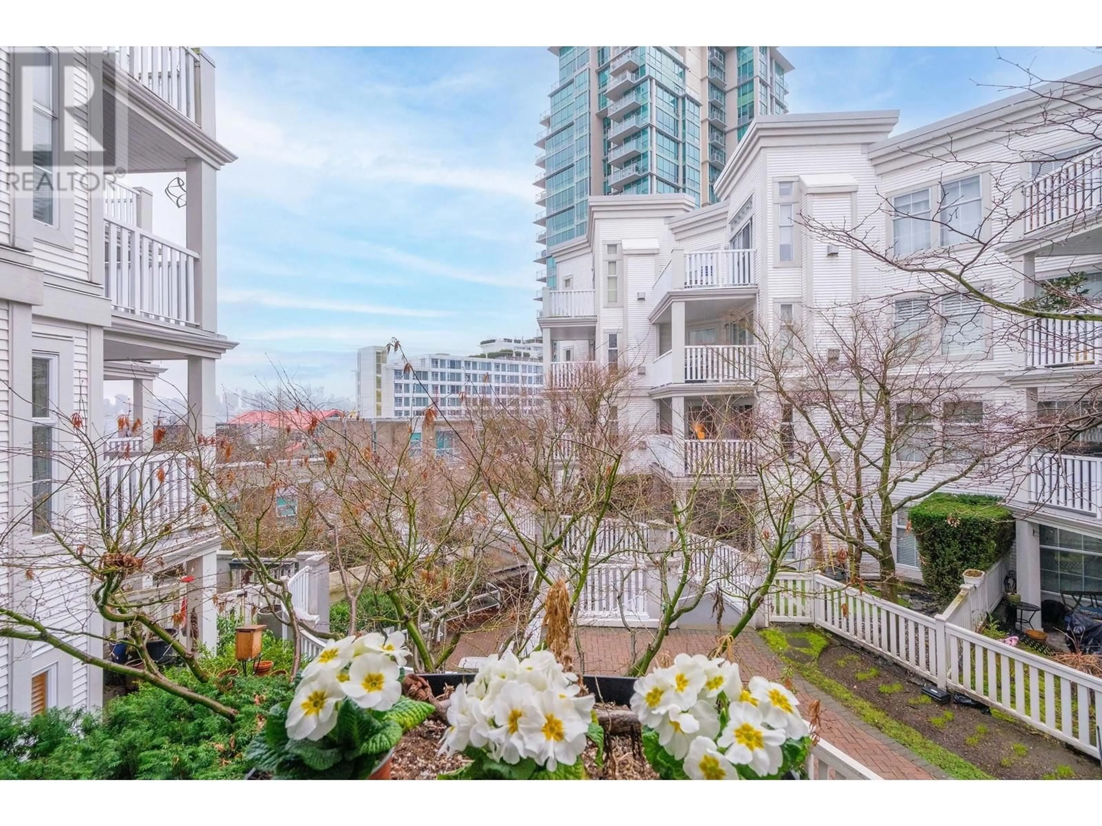 Patio, city buildings view from balcony for 215 147 E 1ST STREET STREET, North Vancouver British Columbia V7L1B2