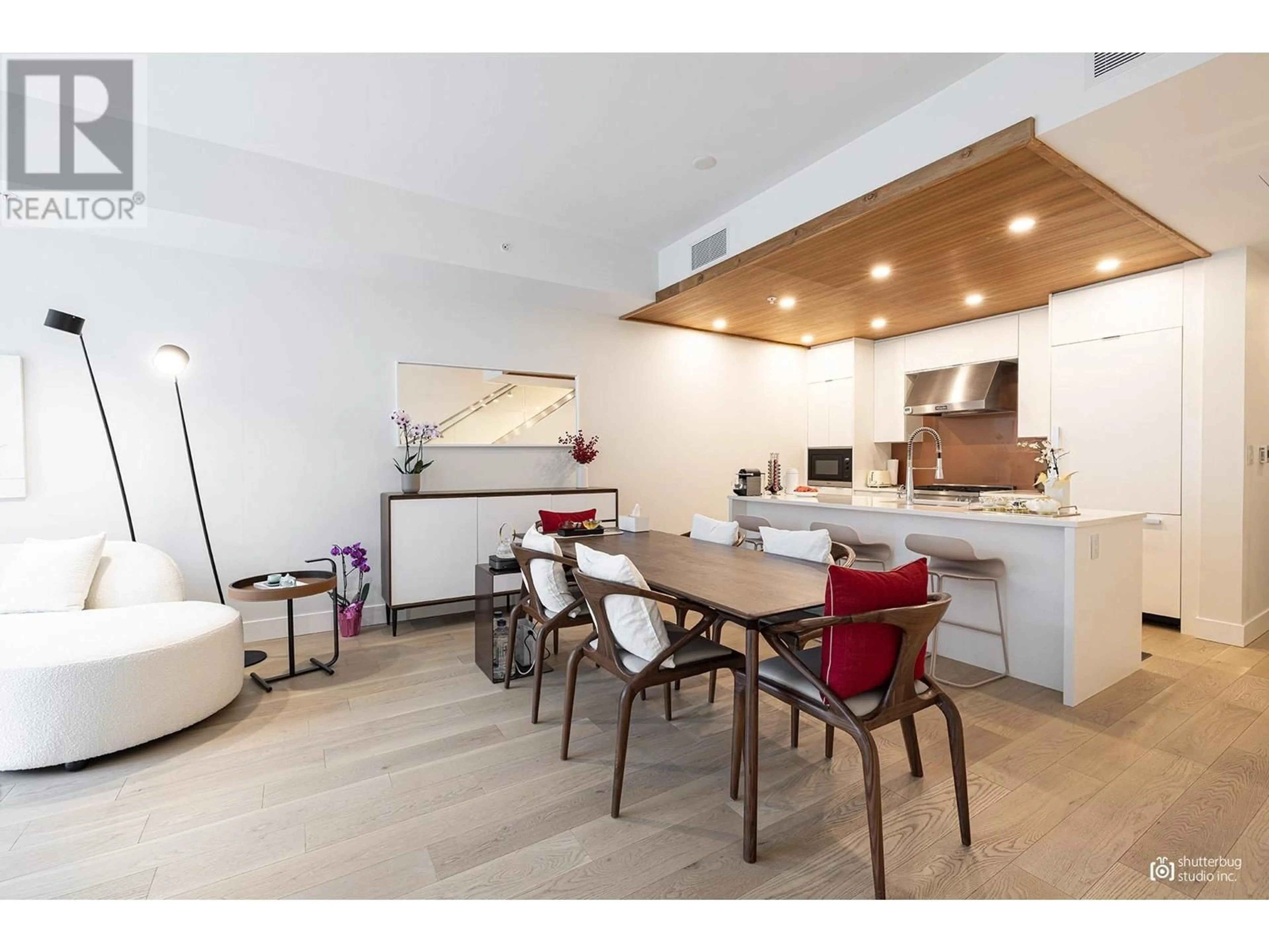 Open concept kitchen, wood/laminate floor for 104 - 6687 NELSON AVENUE, Vancouver British Columbia V7W2B2