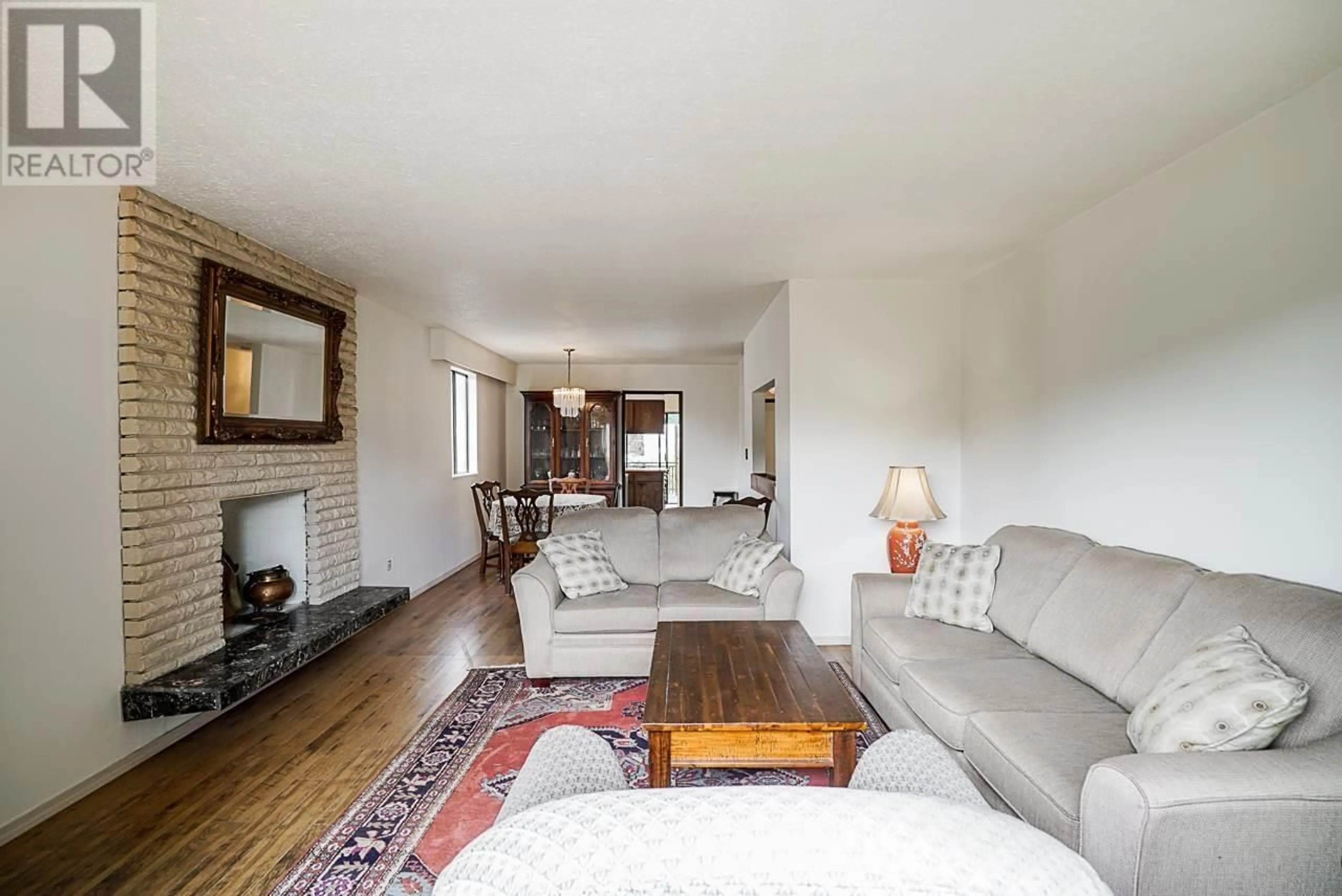 Living room with furniture, wood/laminate floor for 3469 W 8TH AVENUE, Vancouver British Columbia V6R1Y6