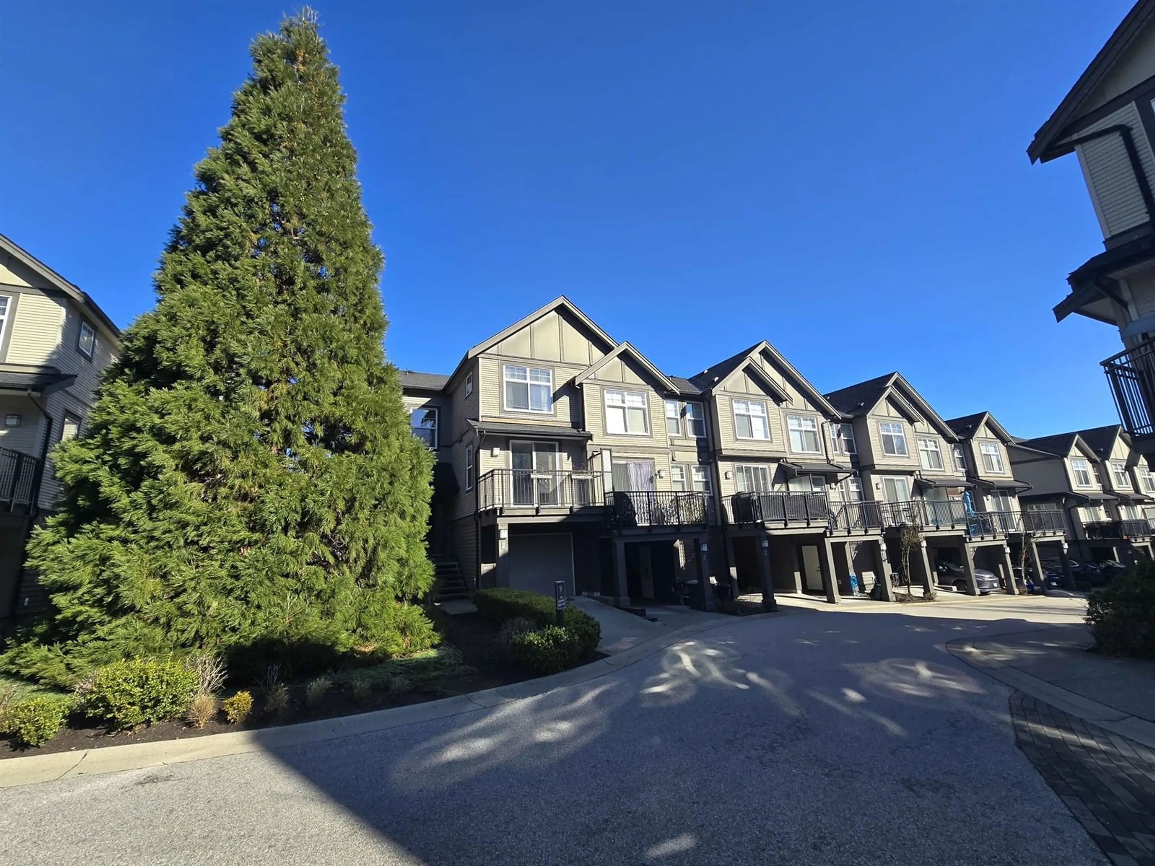 A pic from outside/outdoor area/front of a property/back of a property/a pic from drone, mountain view for 14 15788 104 AVENUE, Surrey British Columbia V4N6M6