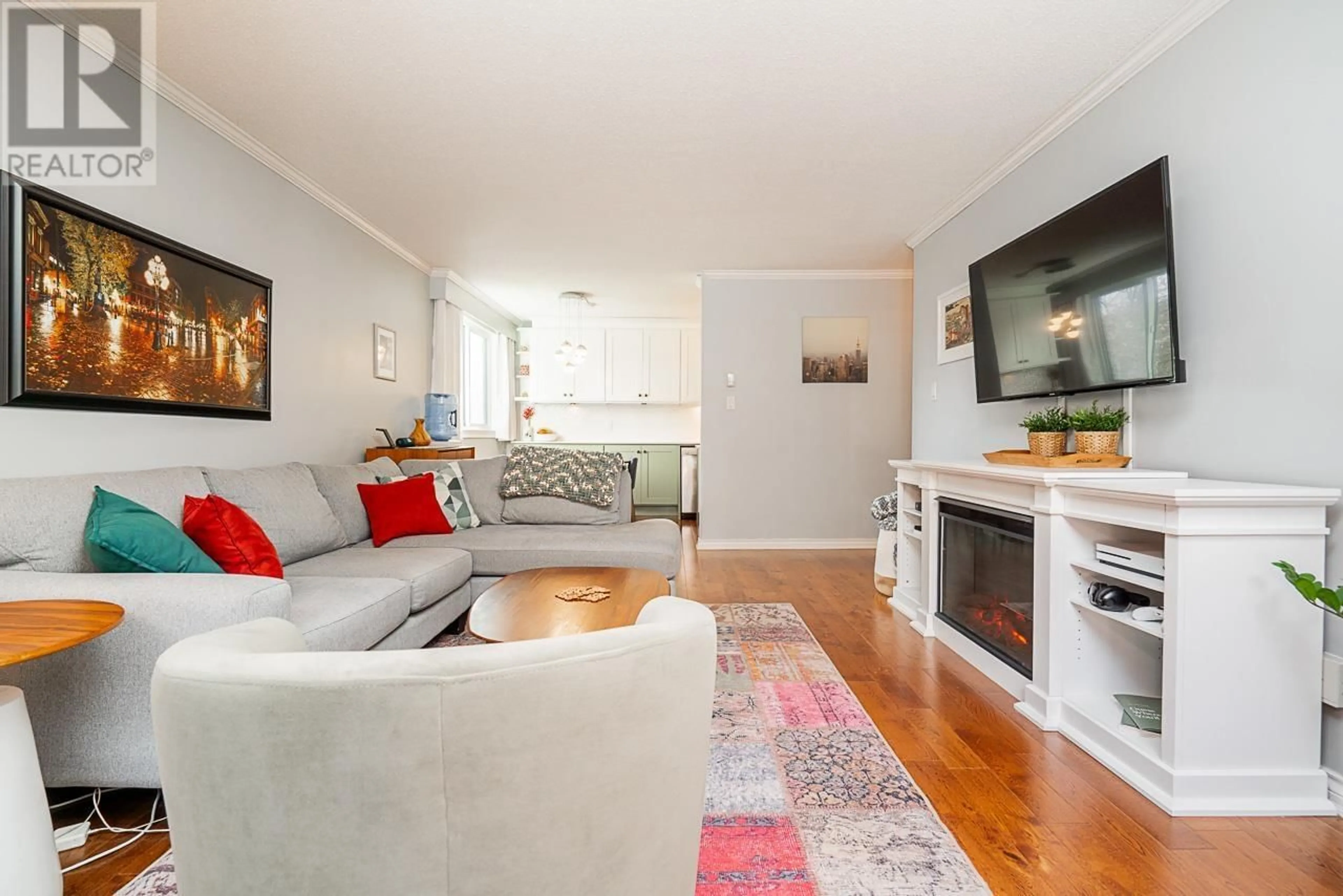 Living room with furniture, wood/laminate floor for 108 307 W 2ND STREET, North Vancouver British Columbia V7M1E2