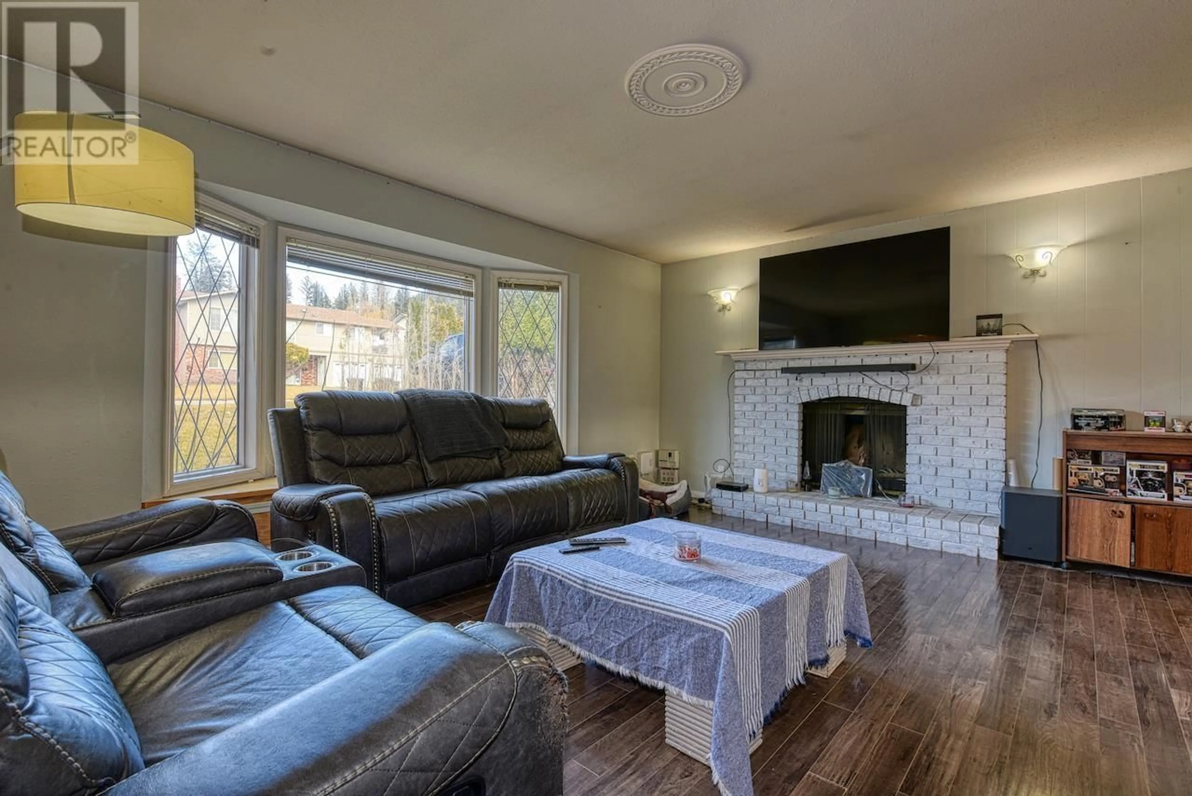 Living room with furniture, wood/laminate floor for 346 LITZENBURG CRESCENT, Williams Lake British Columbia V2G4G8