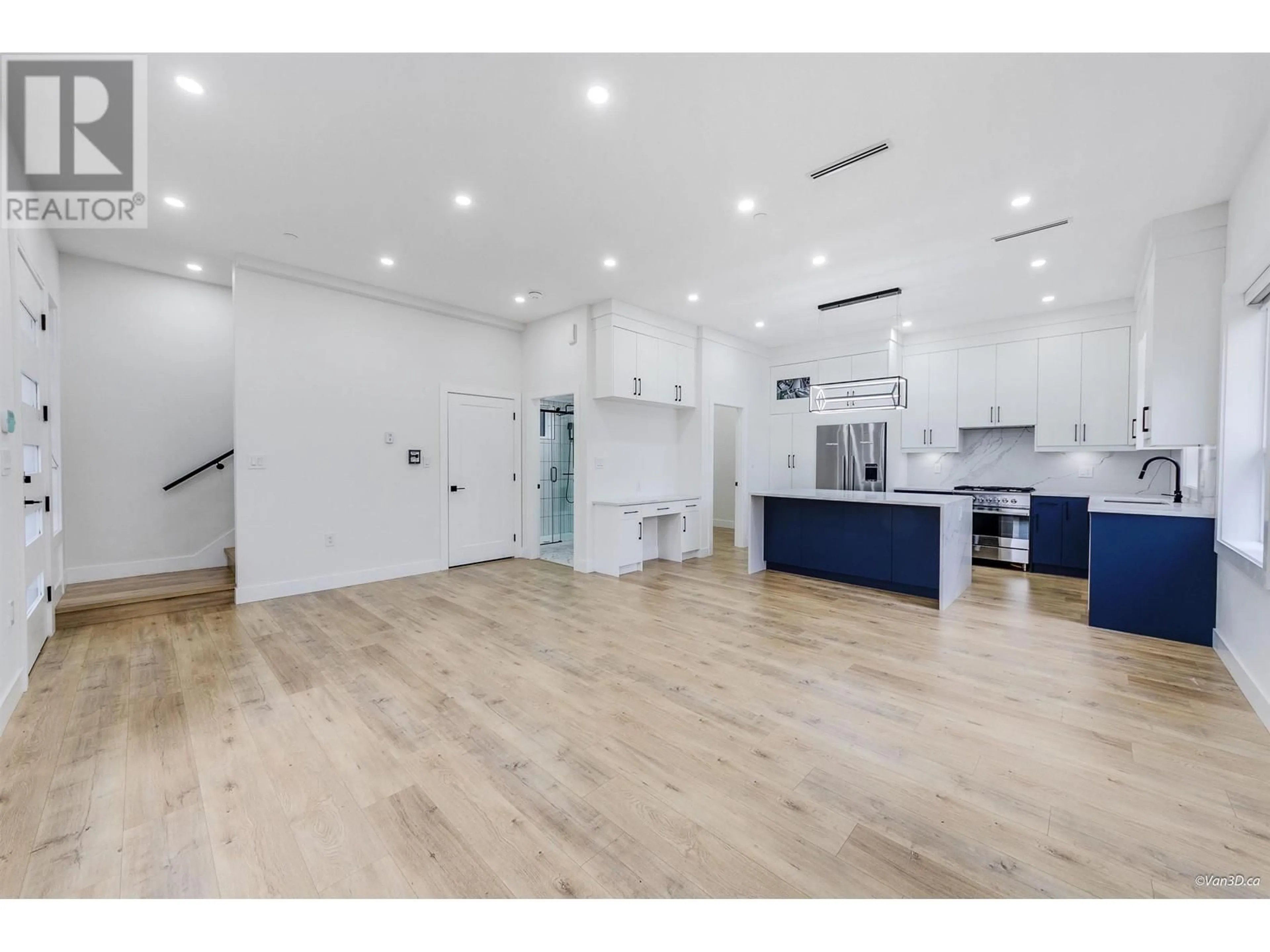 Open concept kitchen, wood/laminate floor for 2995 17TH AVENUE, Vancouver British Columbia V5M2N4