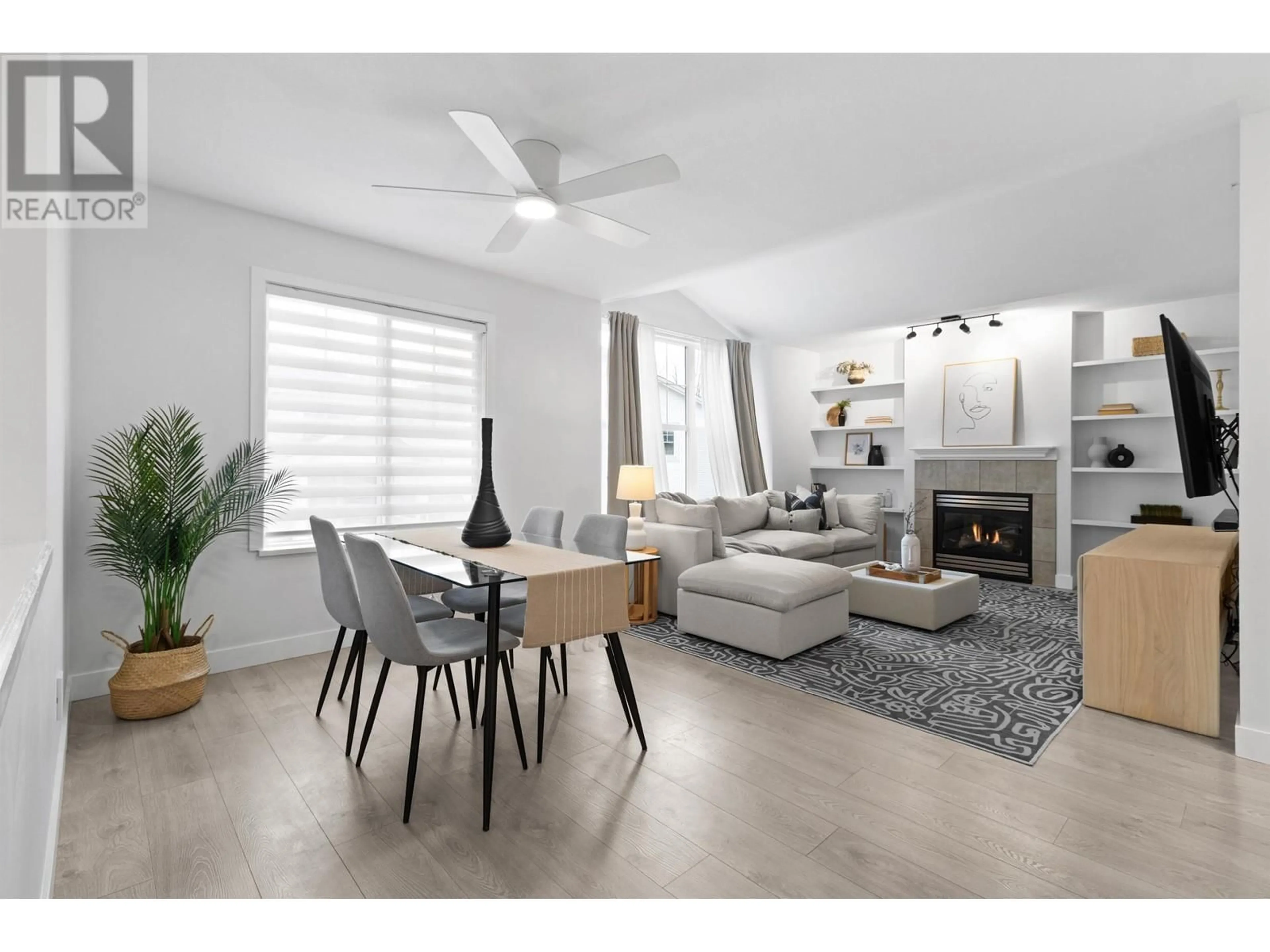 Living room with furniture, wood/laminate floor for 401 3000 RIVERBEND DRIVE, Coquitlam British Columbia V3C6R1
