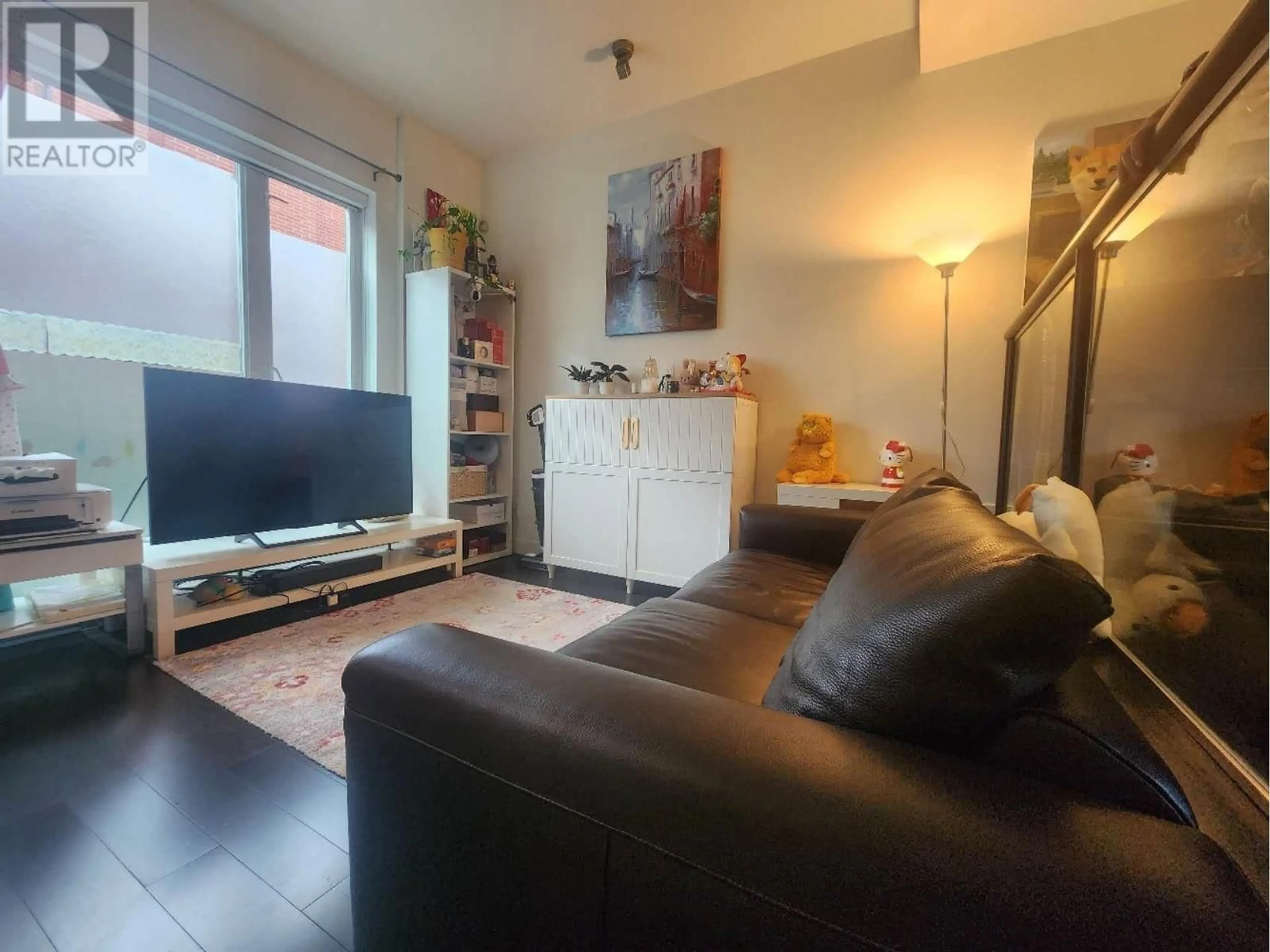 Living room with furniture, floor is not visible for 217 - 1961 COLLINGWOOD STREET, Vancouver British Columbia V6R3K6
