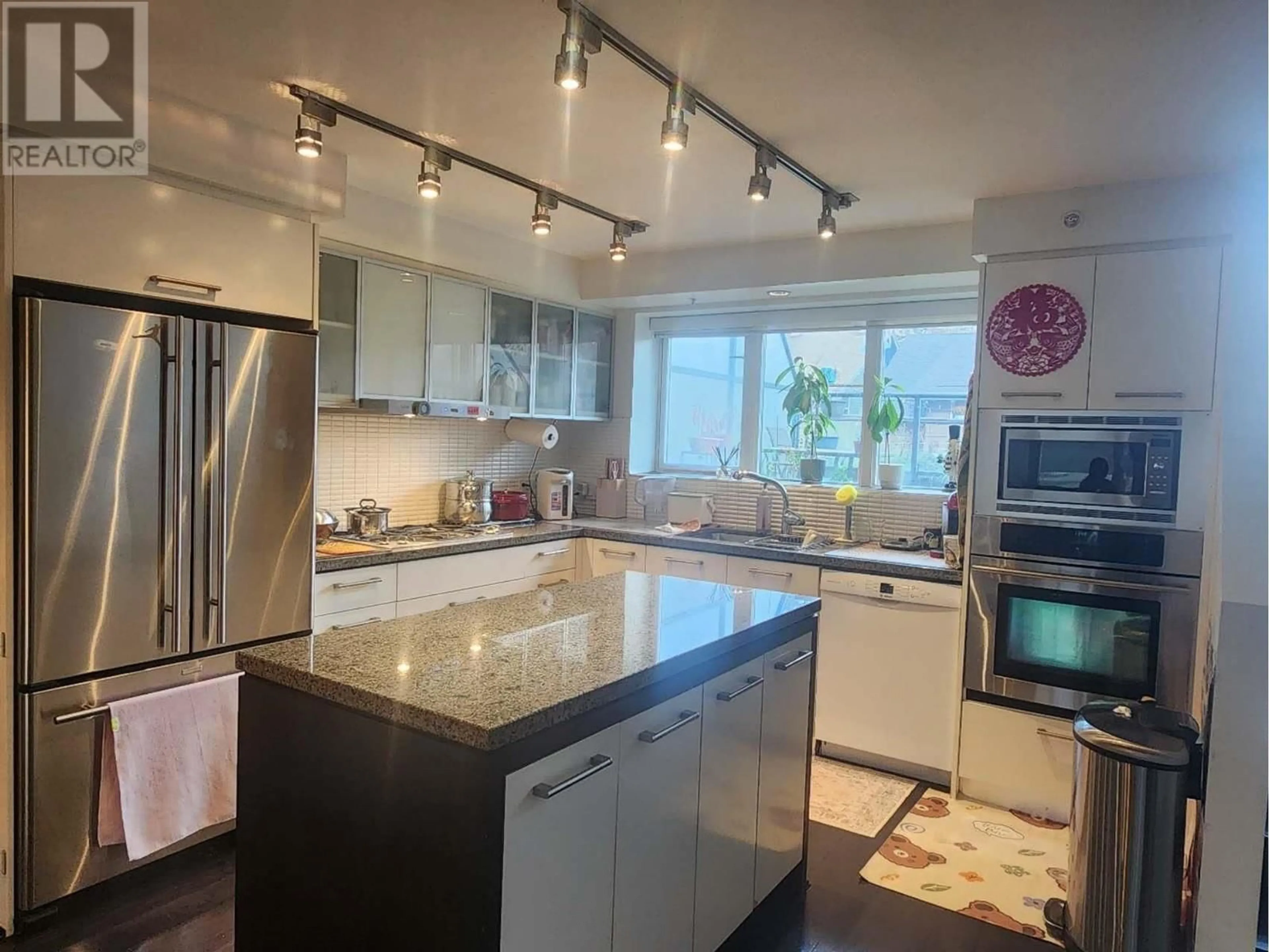 Contemporary kitchen, ceramic/tile floor for 217 - 1961 COLLINGWOOD STREET, Vancouver British Columbia V6R3K6