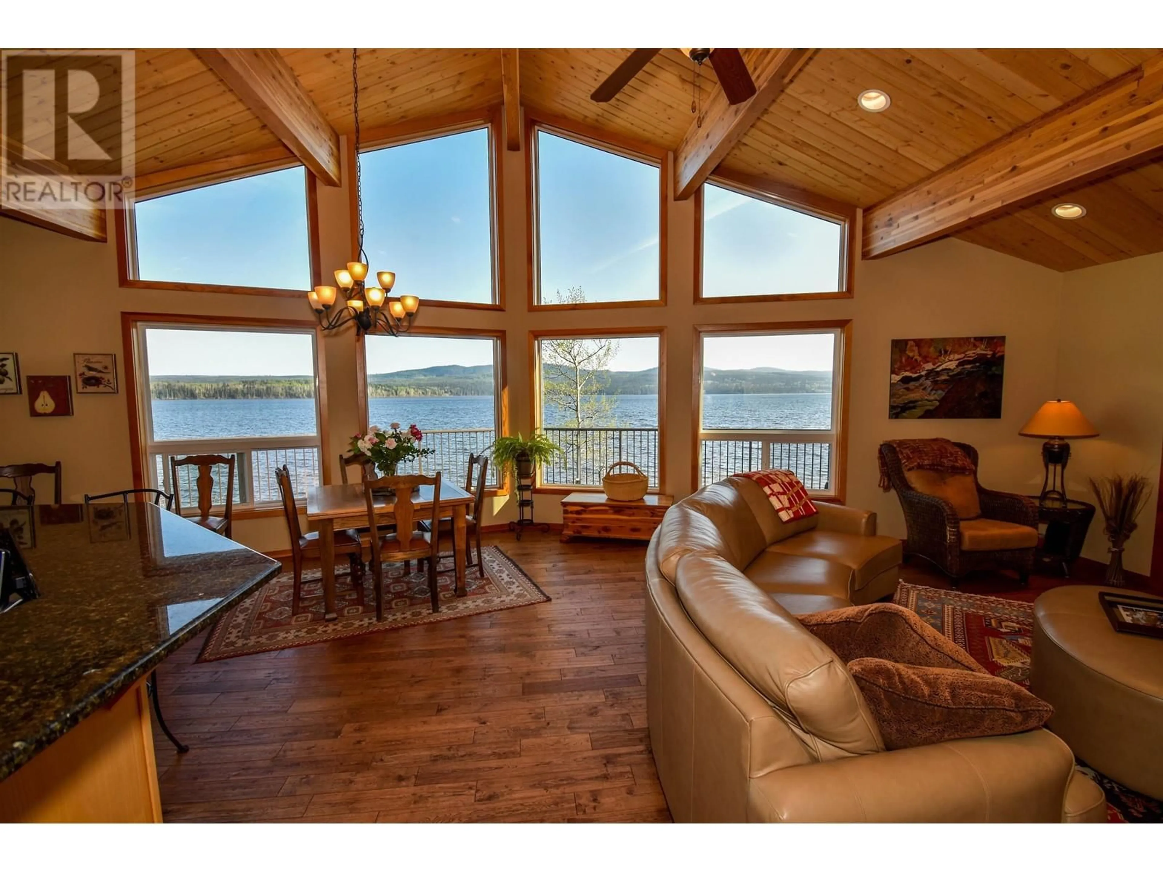 Living room with furniture, wood/laminate floor for 38537 DRIFTWOOD DRIVE, Burns Lake British Columbia V0J1E2