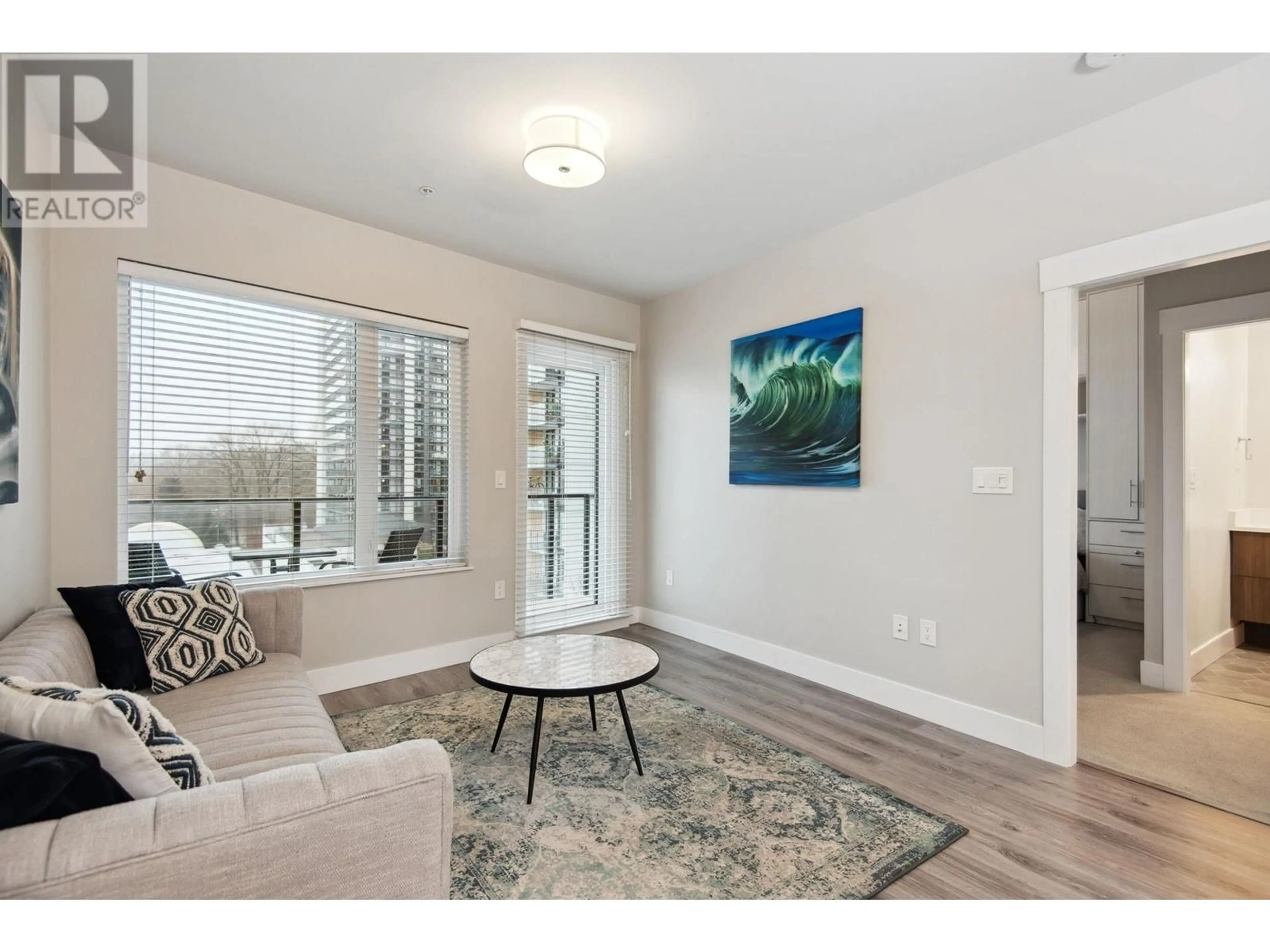 Living room with furniture, wood/laminate floor for 603 - 1496 CHARLOTTE ROAD, North Vancouver British Columbia V7J0C9