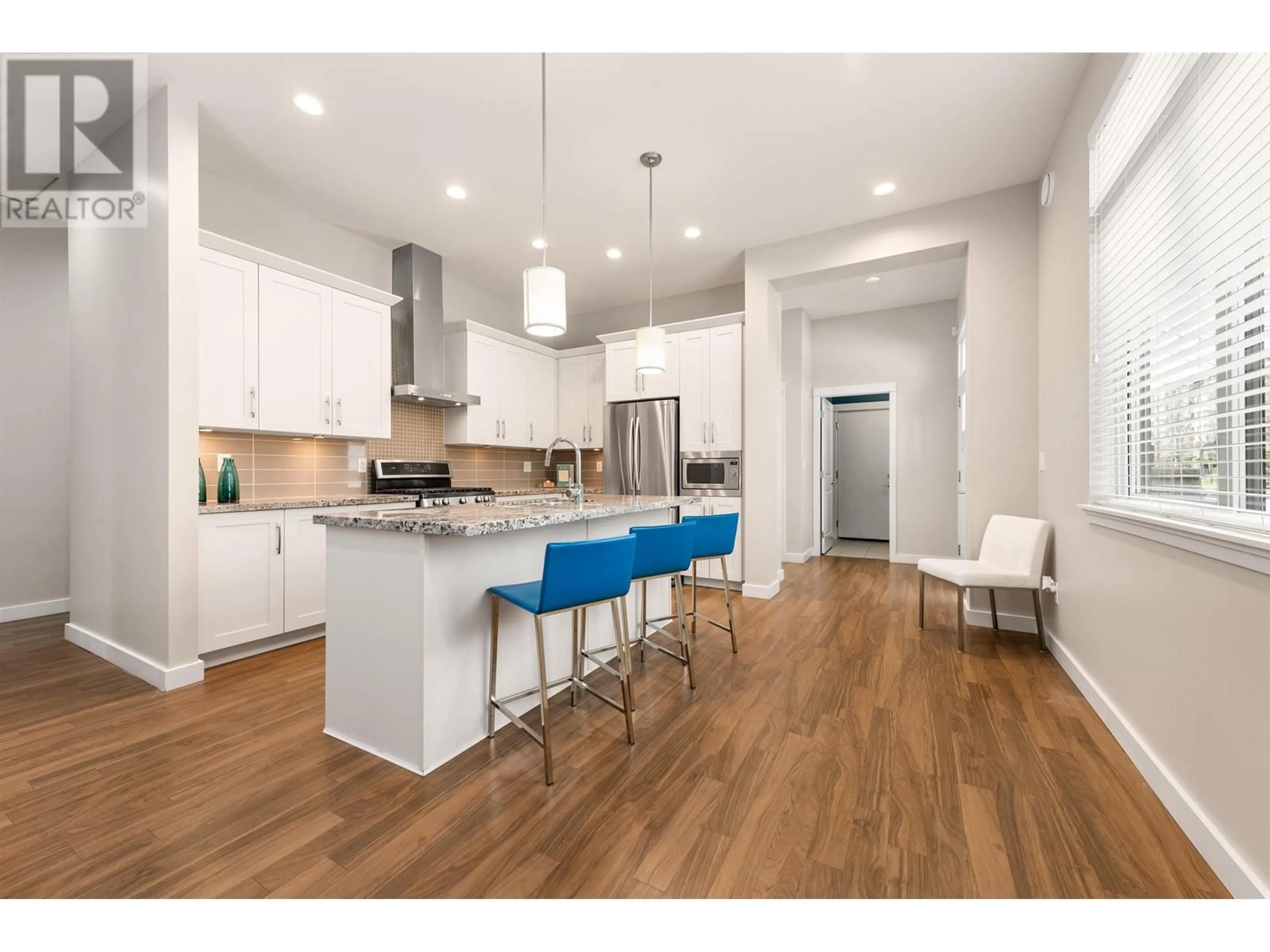 Open concept kitchen, wood/laminate floor for 5090 SPRINGS BOULEVARD, Delta British Columbia V4M0A6