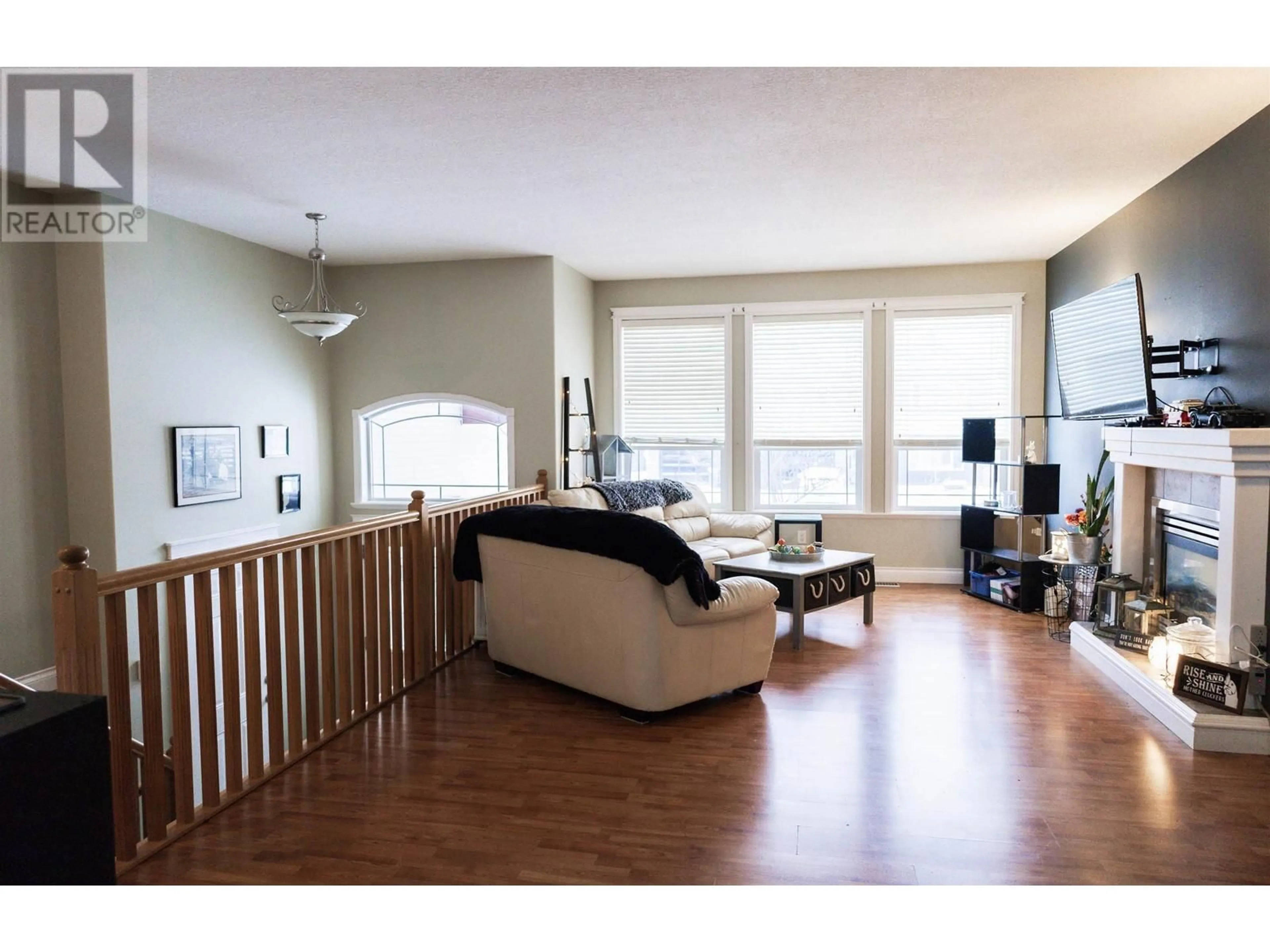 Living room with furniture, wood/laminate floor for 6754 CHARTWELL CRESCENT, Prince George British Columbia V2N6Y3