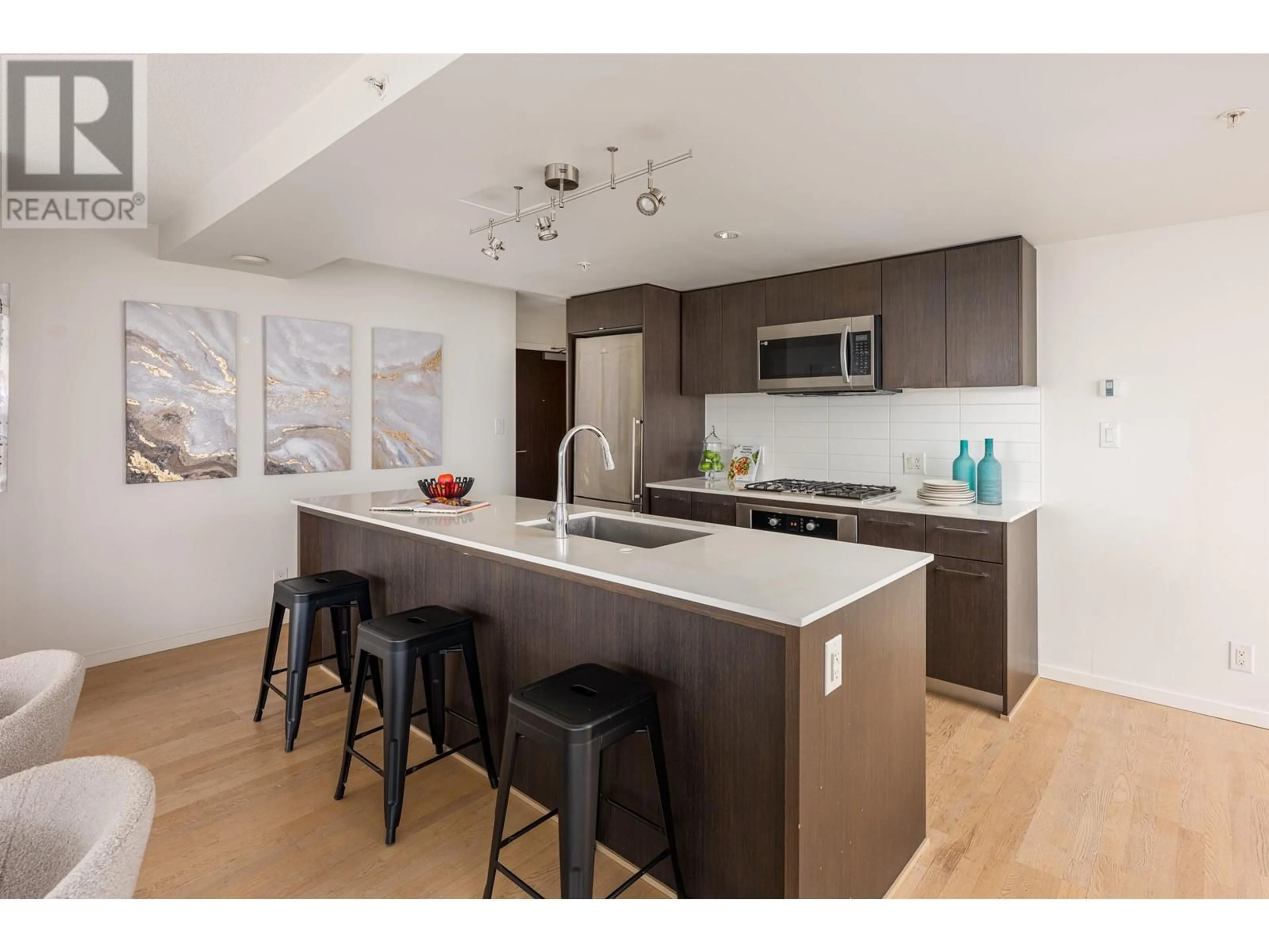 Open concept kitchen, wood/laminate floor for 1706 7988 ACKROYD ROAD, Richmond British Columbia V6X0K6