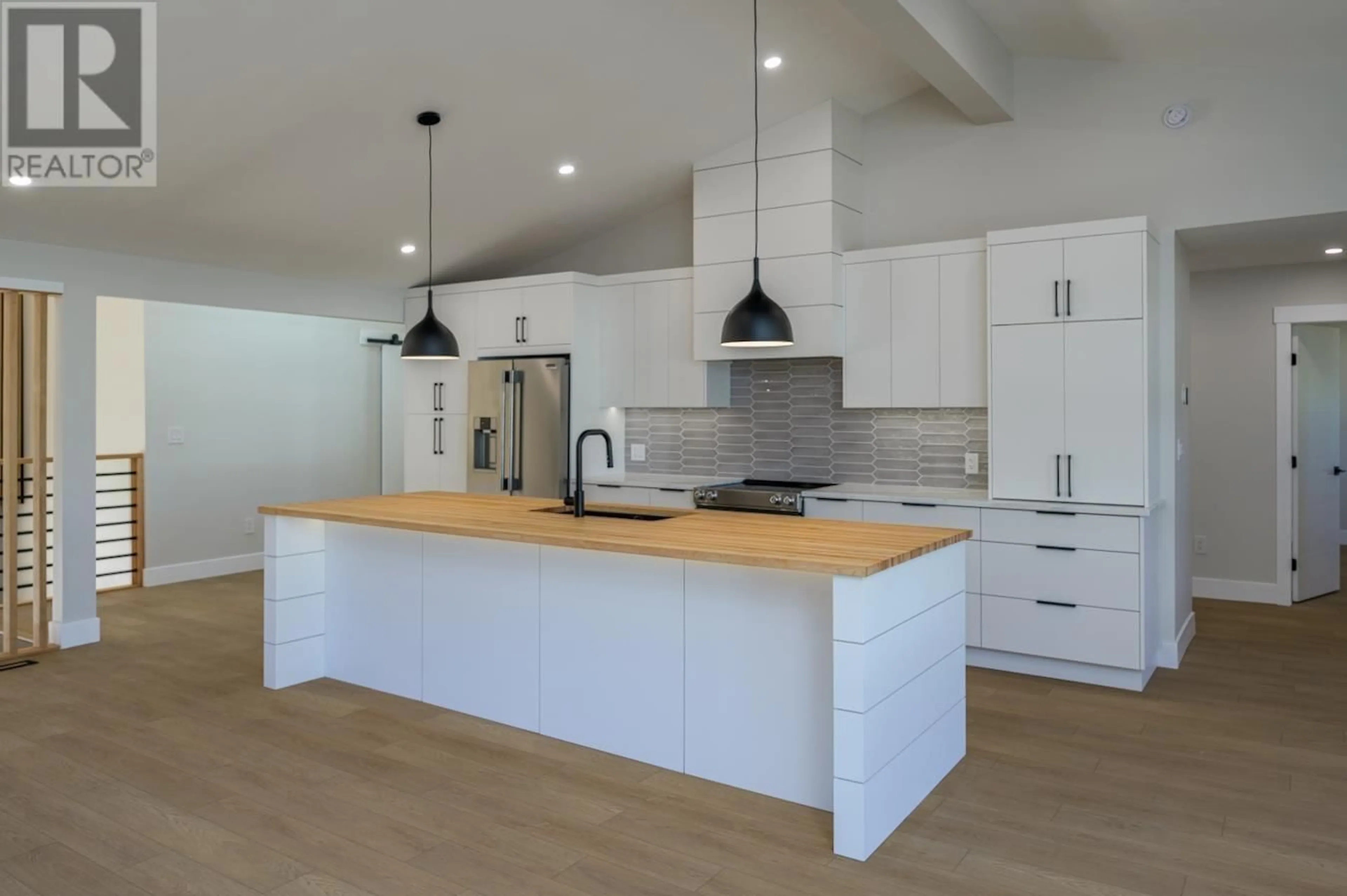 Open concept kitchen, wood/laminate floor for 4285 CRAIG DRIVE, Prince George British Columbia V2K1E4
