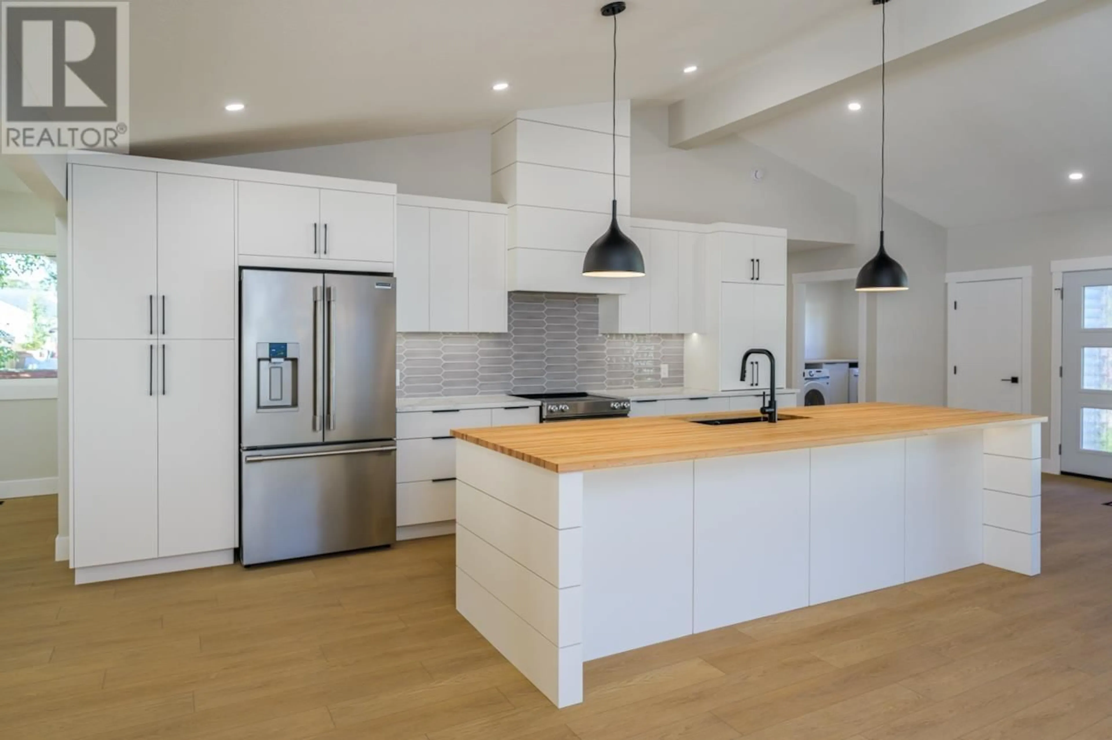 Open concept kitchen, wood/laminate floor for 4285 CRAIG DRIVE, Prince George British Columbia V2K1E4