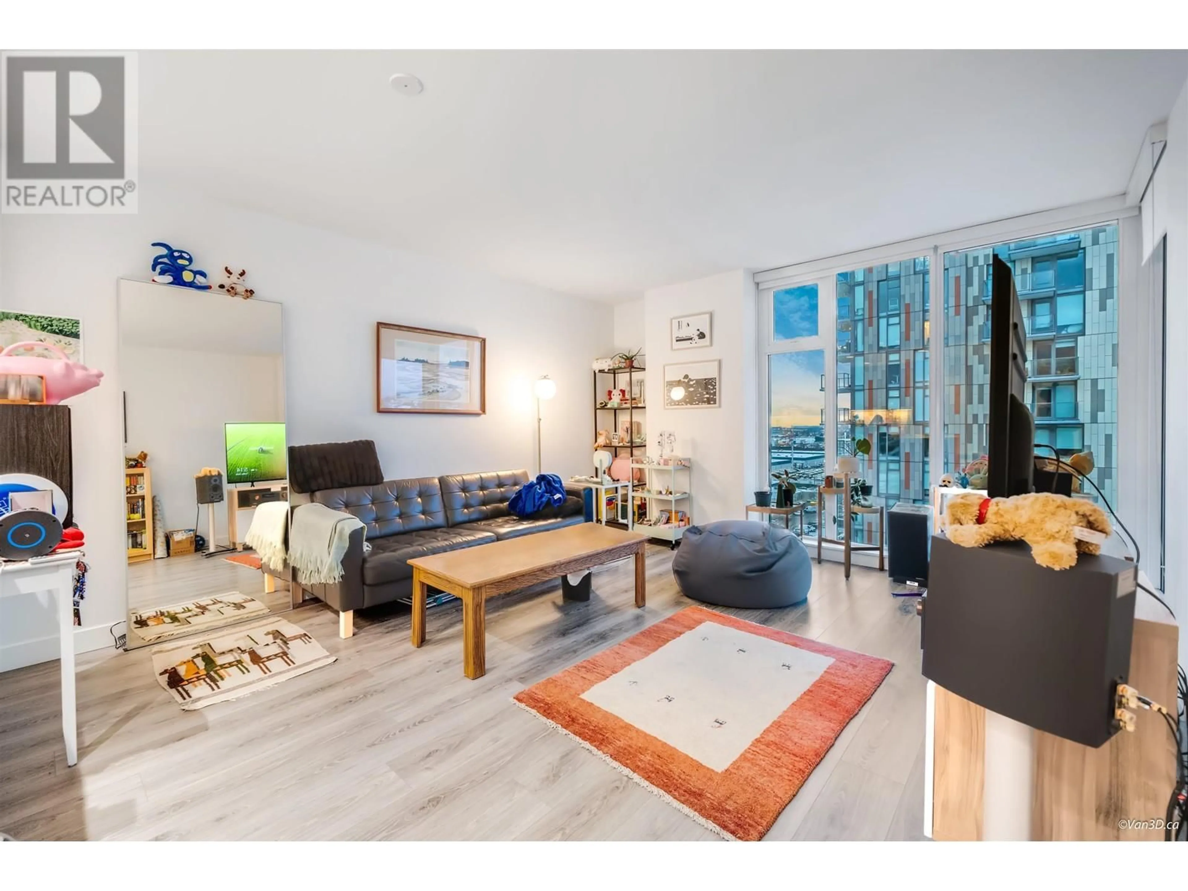 Living room with furniture, wood/laminate floor for 1108 - 8181 CHESTER STREET, Vancouver British Columbia V5X0J9
