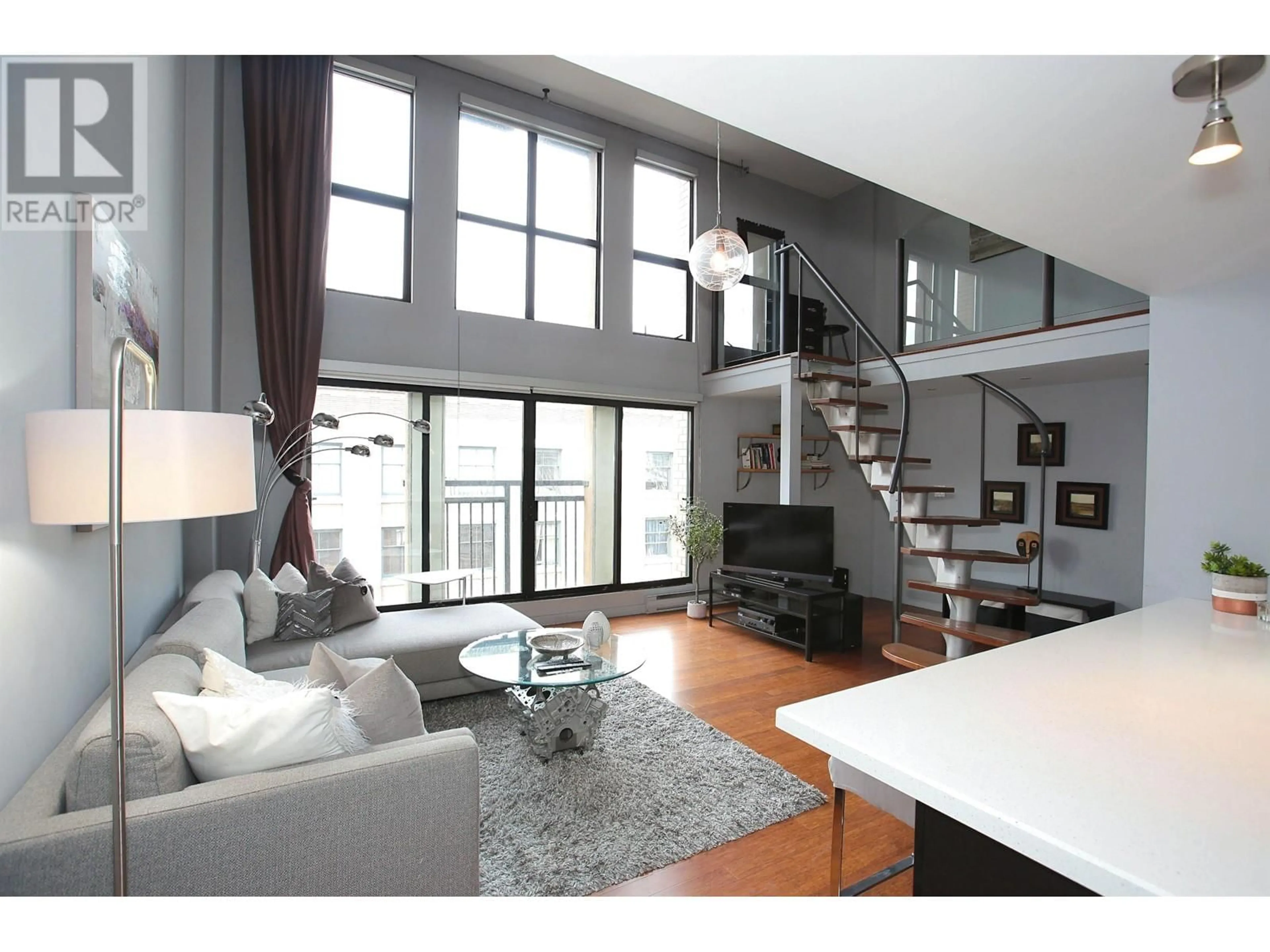 Living room with furniture, wood/laminate floor for 511 - 22 CORDOVA STREET, Vancouver British Columbia V6A1K2