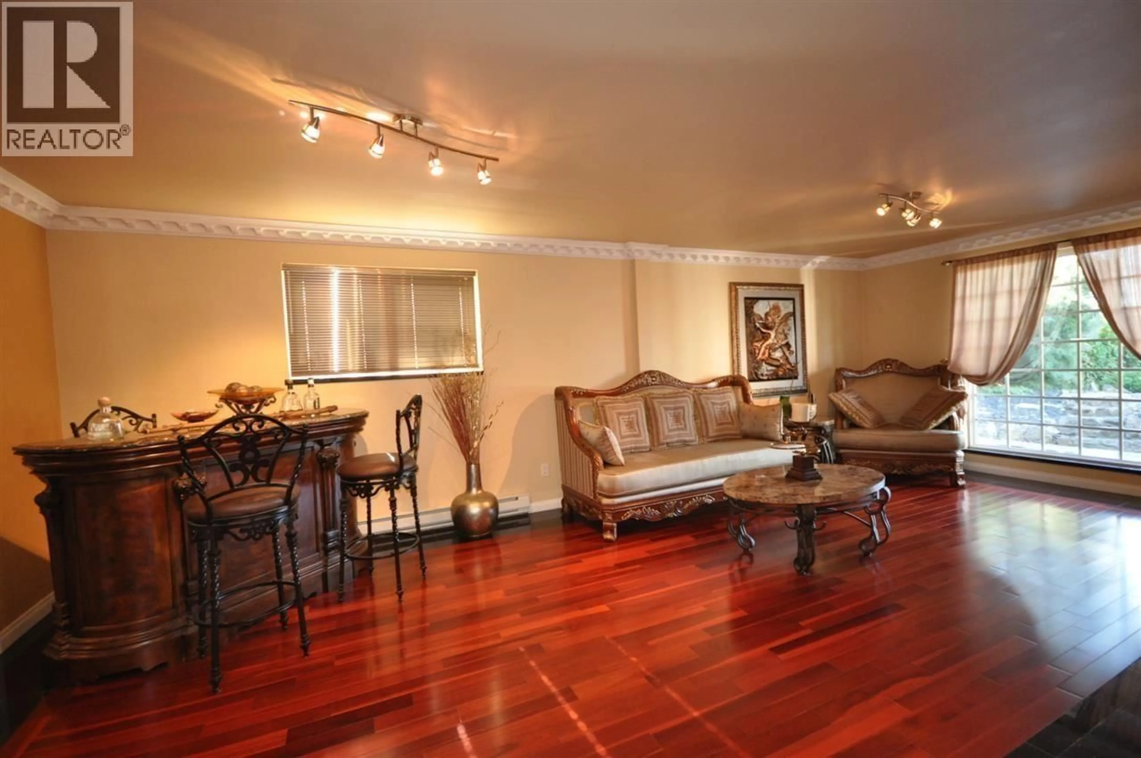 Living room with furniture, wood/laminate floor for 7426 BURRIS STREET, Burnaby British Columbia V5G1N2