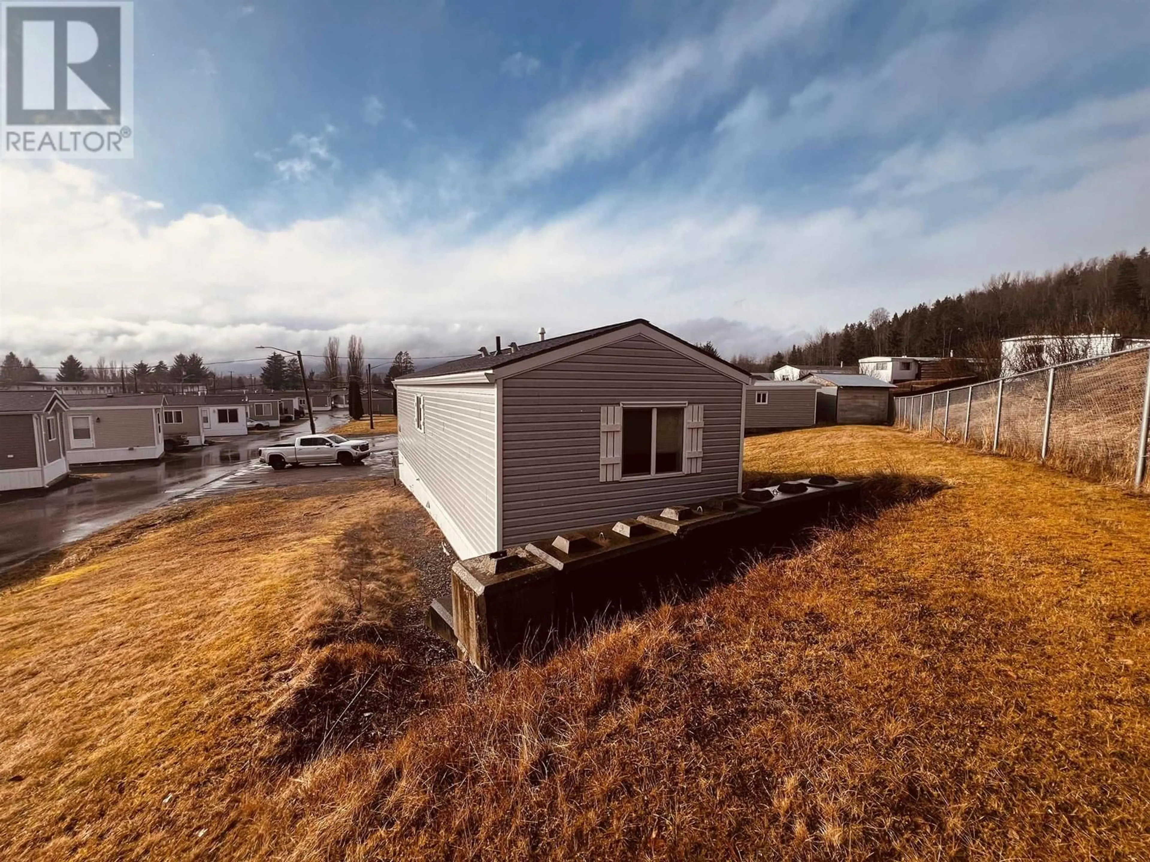 A pic from outside/outdoor area/front of a property/back of a property/a pic from drone, building for 52 - 3614 KALUM STREET, Terrace British Columbia V8G2E1